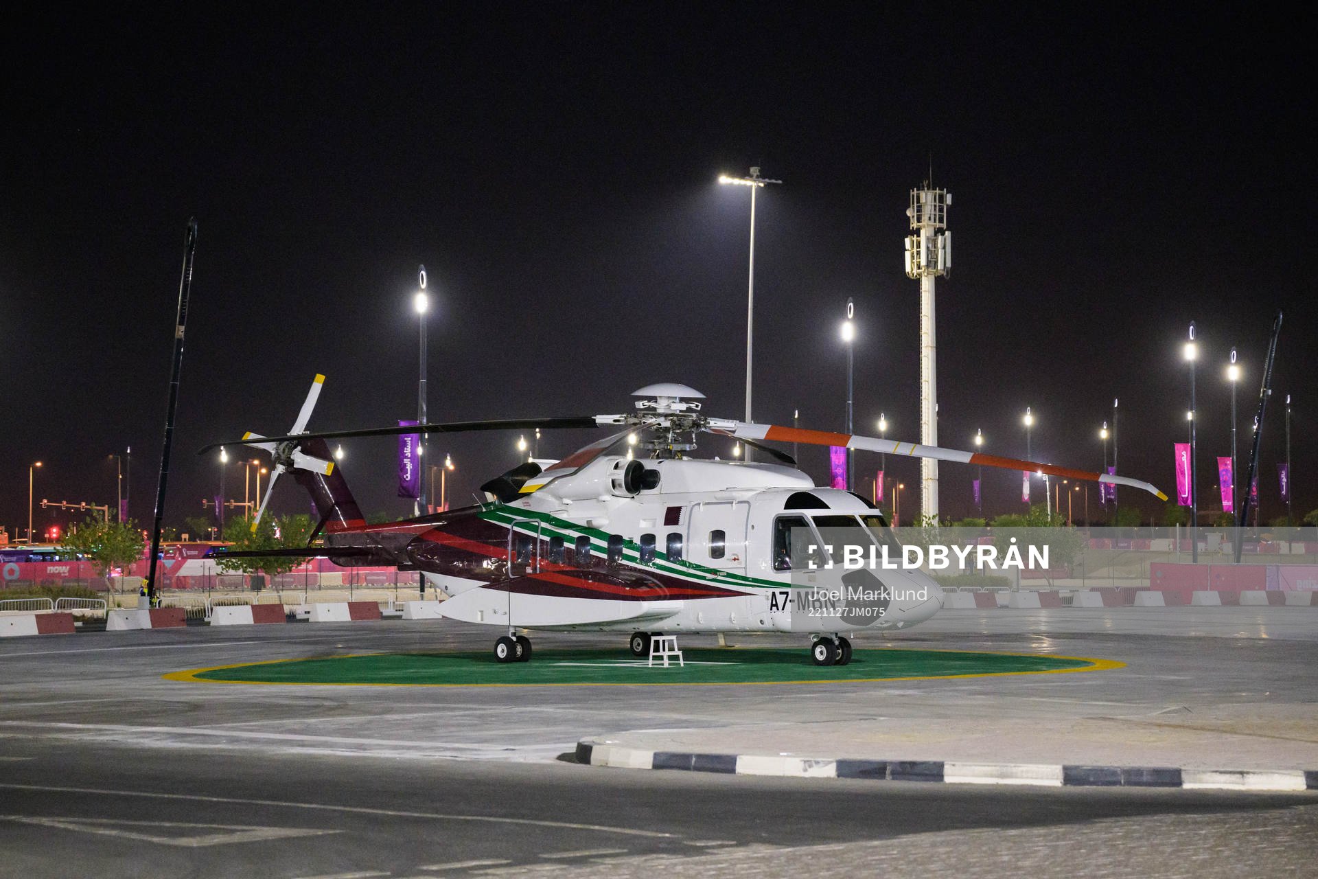 A helicopter parked outside Al Bayt Stadium