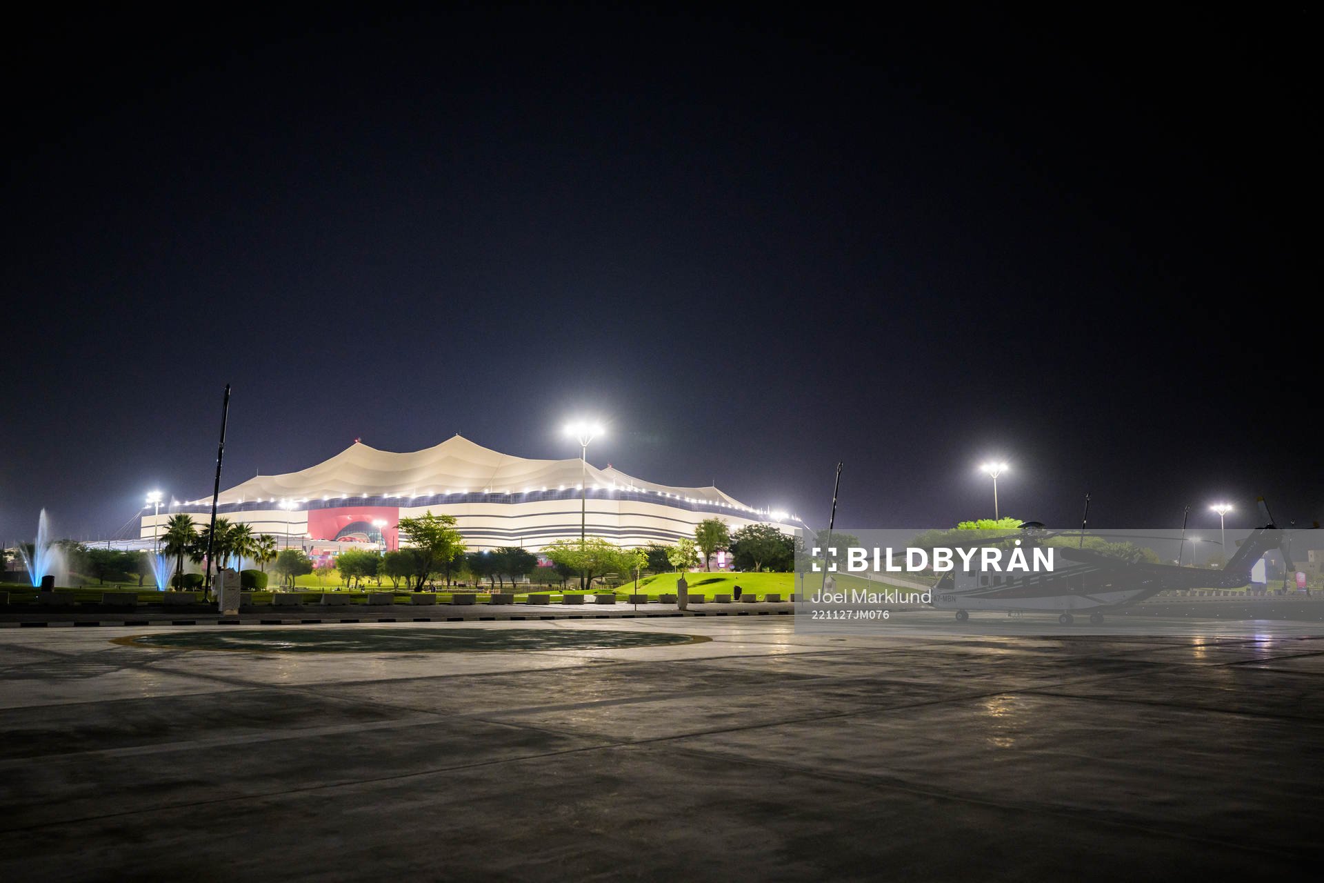 A helicopter parked outside Al Bayt Stadium