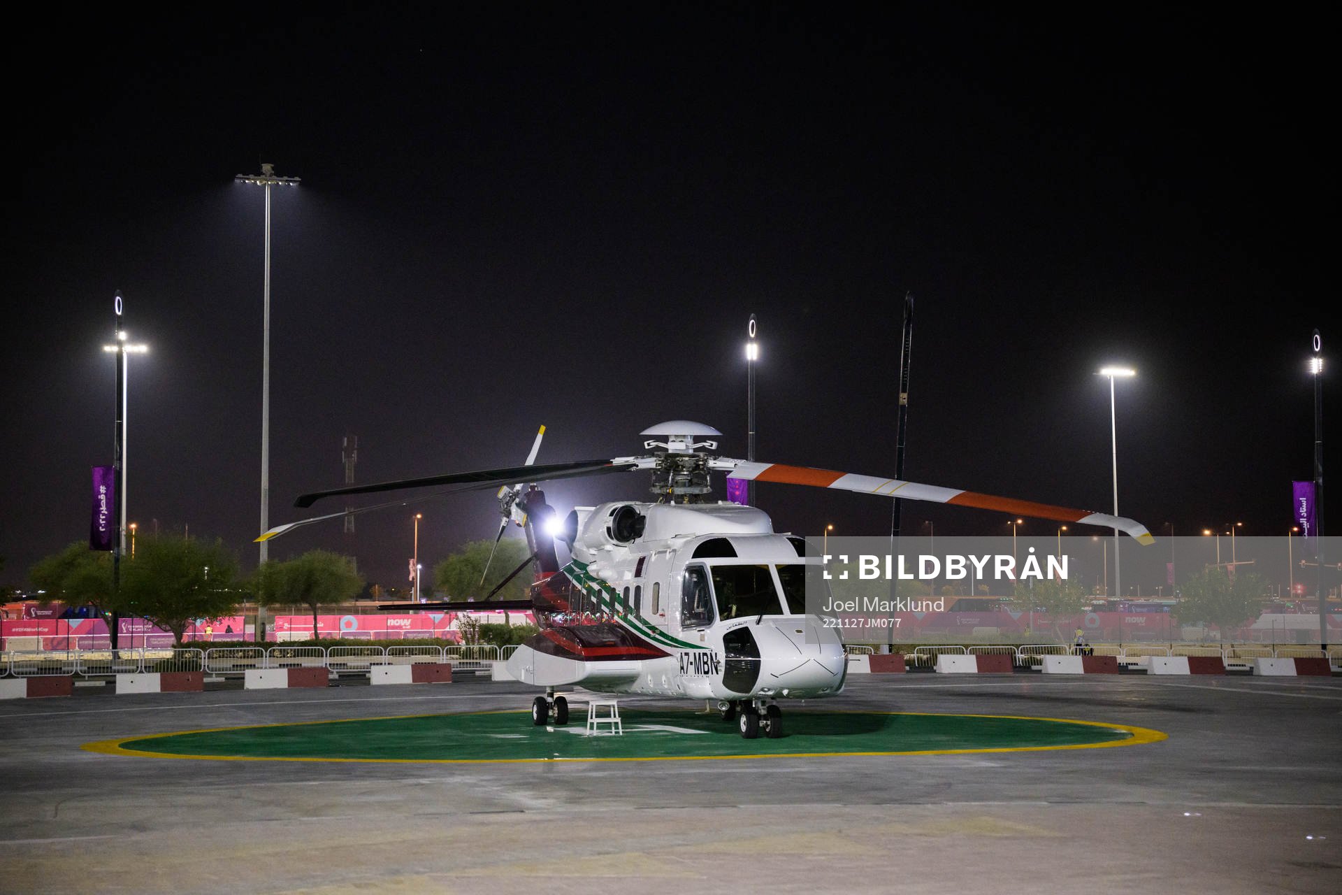 A helicopter parked outside Al Bayt Stadium