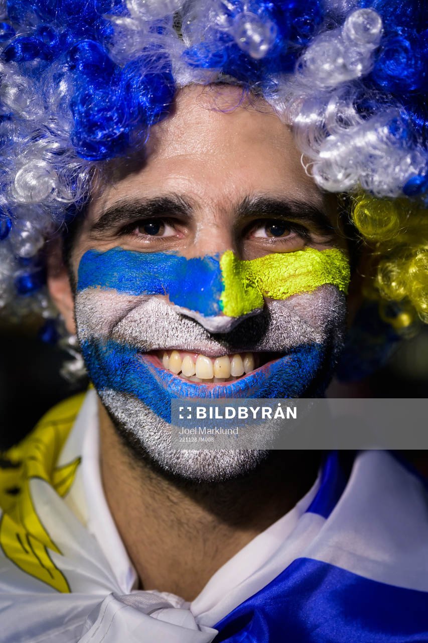 An Uruguay fan poses for a portrait ahead of the FIFA World Cup 2022 football match between Portugal and Uruguay on November 28, 2022 in Doha.