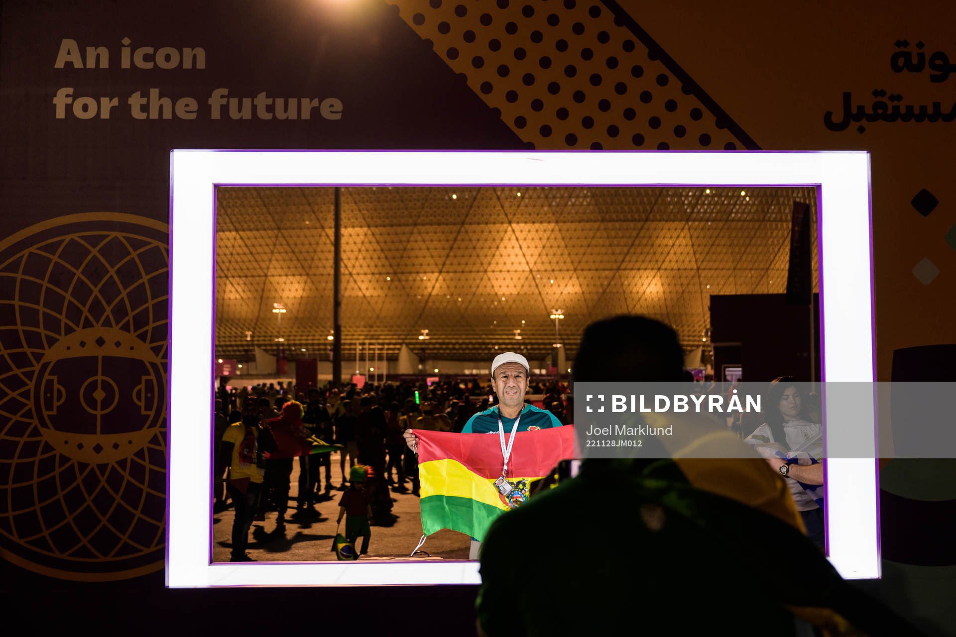A spectator gets his picture taken