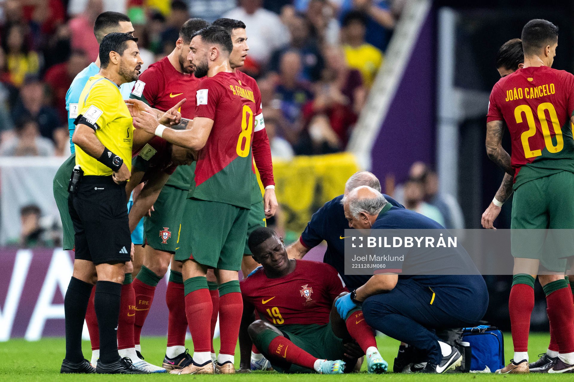 Nuno Mendes of Portugal receives medical attention