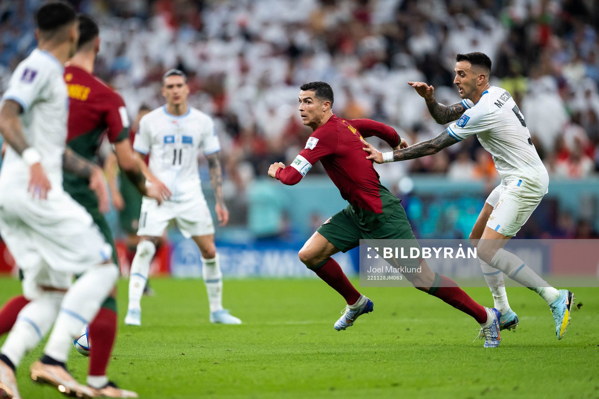 Cristiano Ronaldo of Portugal and Matias Vecino of Uruguay