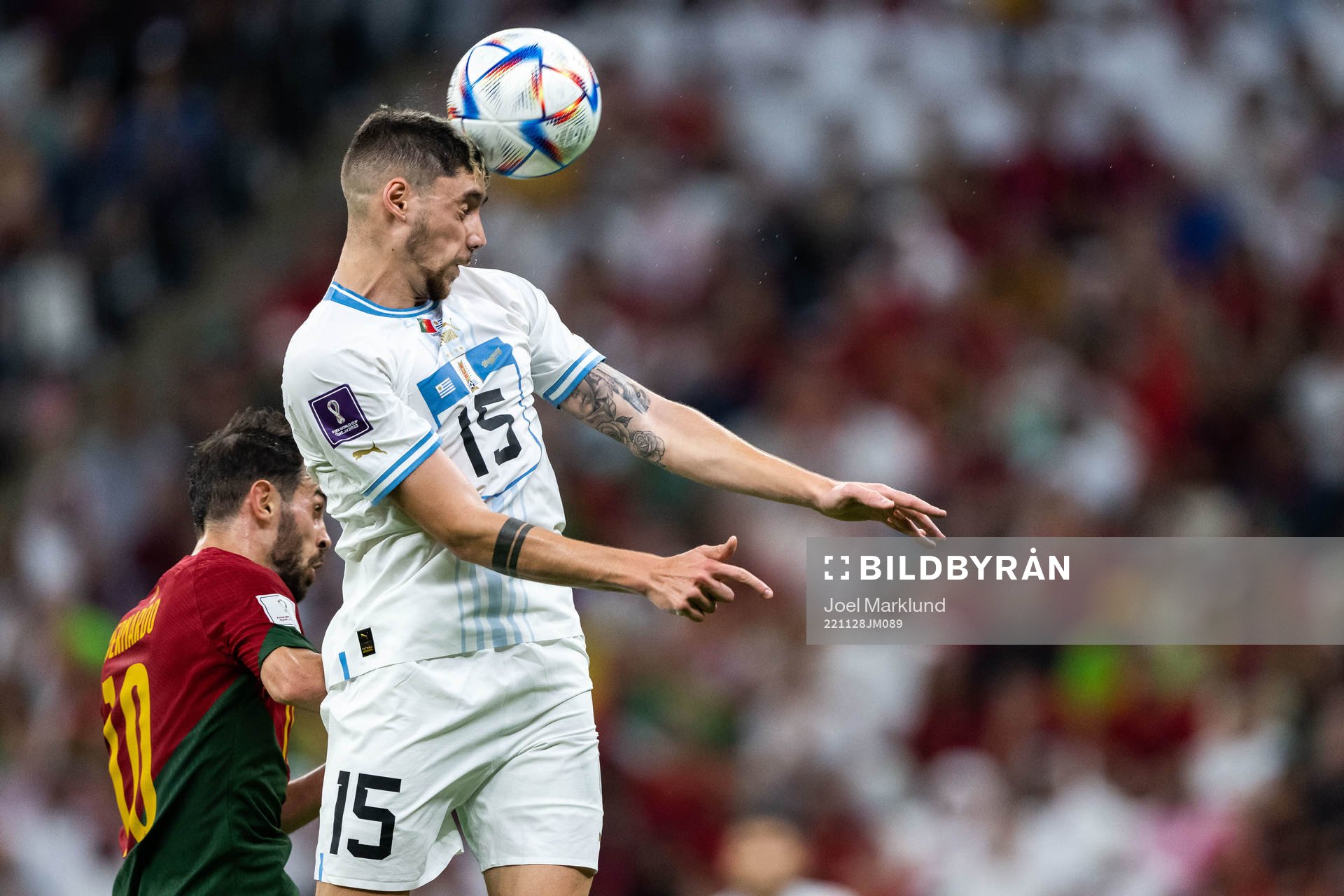 Bernardo Silva of Portugal and Federico Valverde of Uruguay
