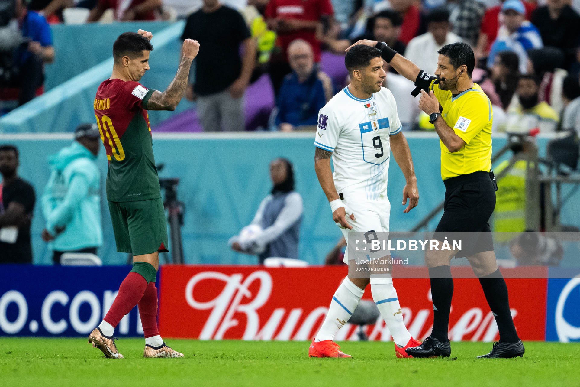 Joao Cancelo of Portugal celebrates, Luis Suarez of Uruguay