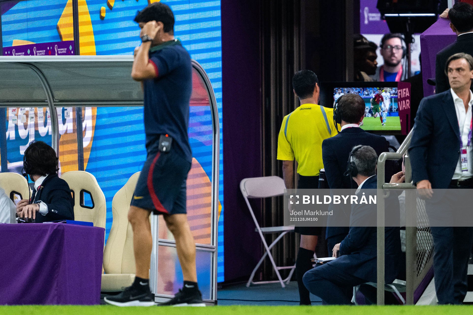 Referee Alireza Faghani  looks at the VAR monitor