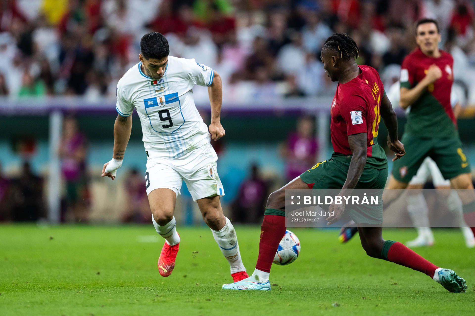 Luis Suarez of Uruguay and Rafael Leao of Portugal