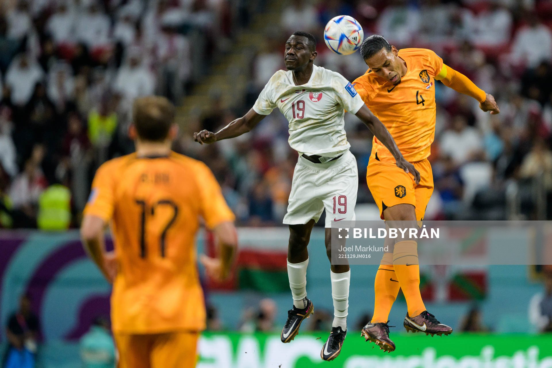 Almoez Ali of Qatar and Virgil van Dijk of Netherlands