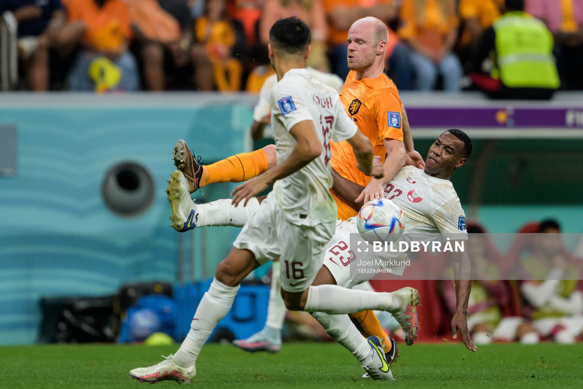 Boualem Khoukhi and Assim Madibo of Qatar against Davy Klaassen of Netherlands during the FIFA World Cup 2022 football match between Netherlands and Qatar on November 29, 2022 in Doha.