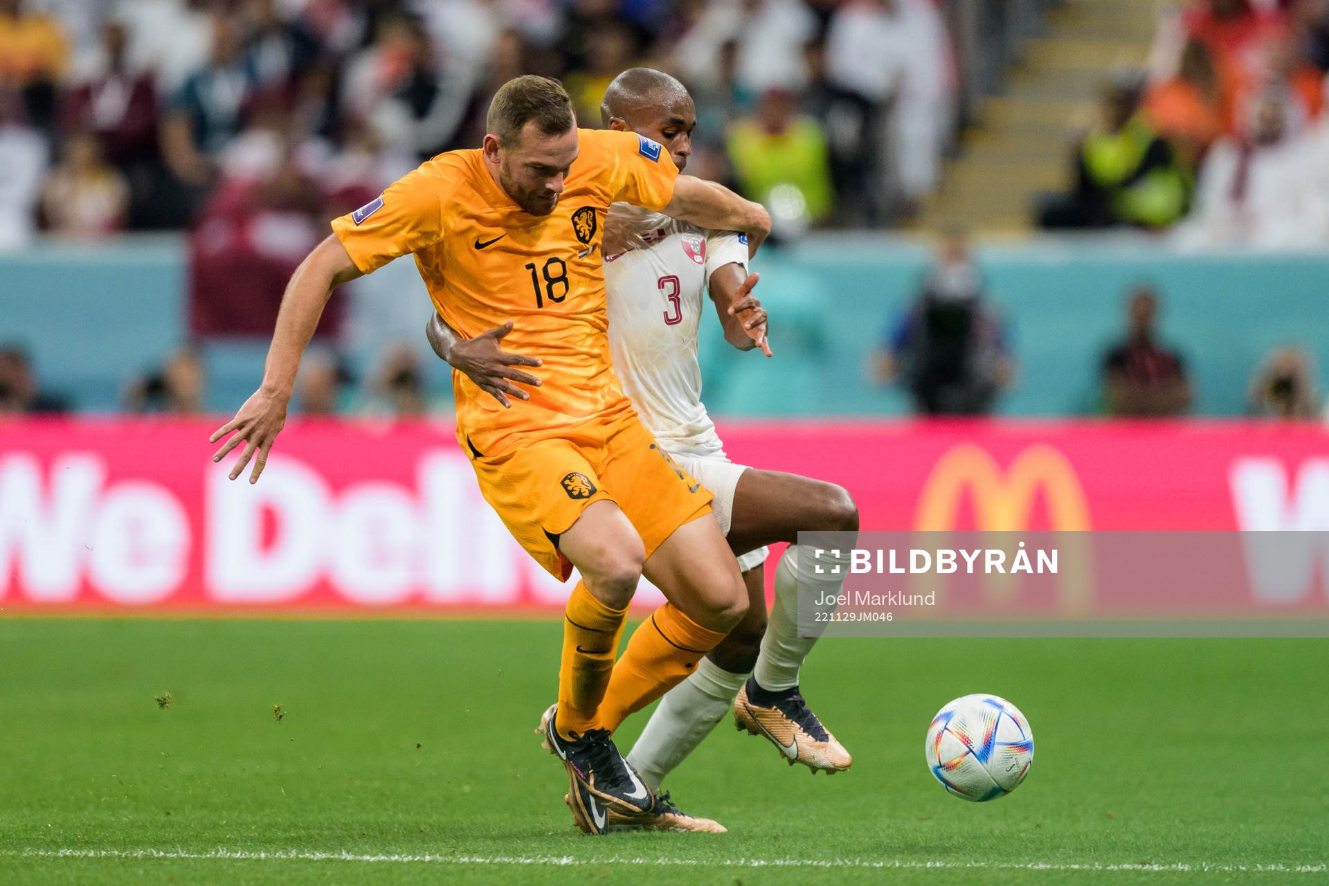 Vincent Janssen of Netherlands and Abdelkarim Hassan of