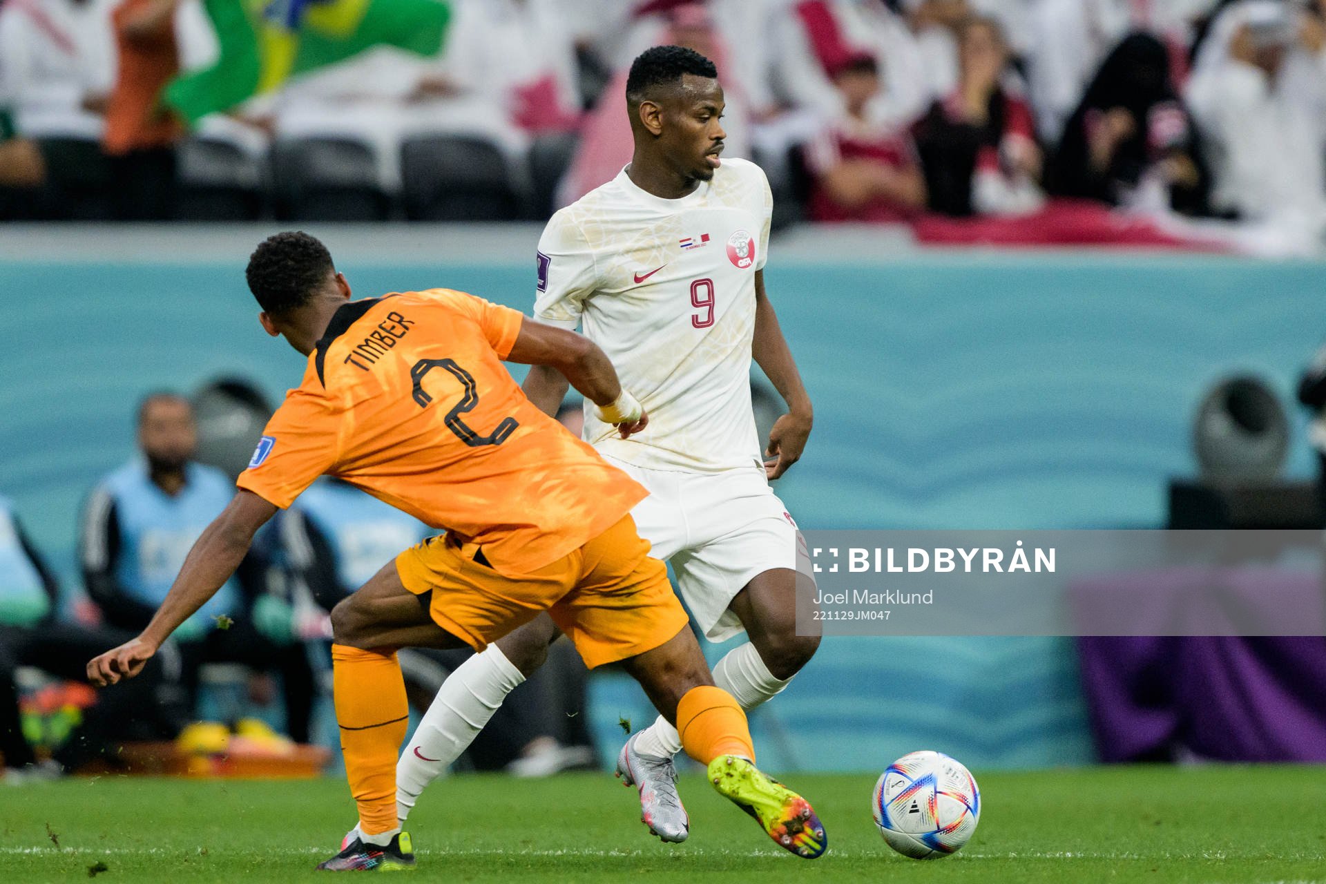 Jurrien Timber of Netherlands and Mohammed Muntari of Qatar