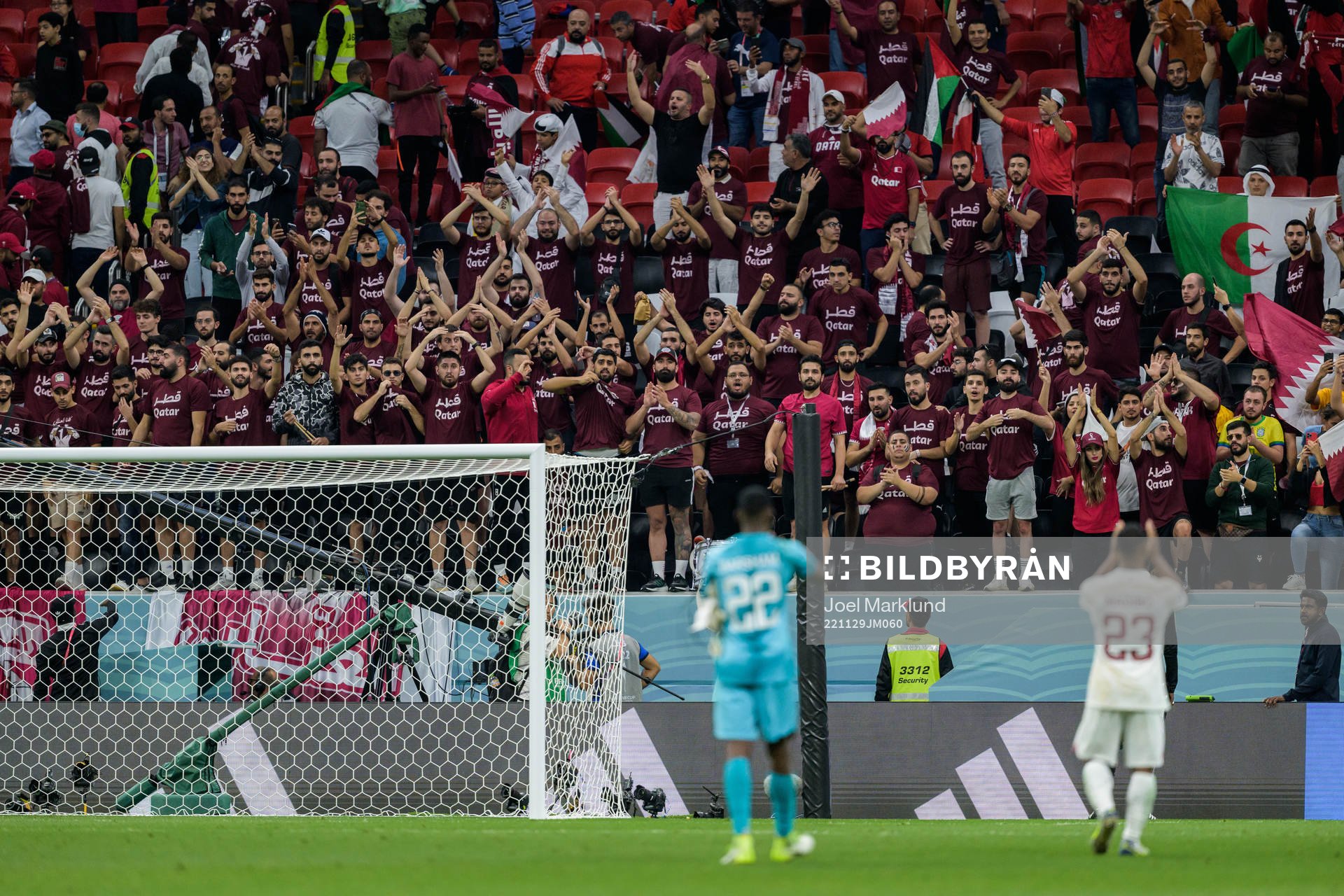Supporters of Qatar together with goalkeeper Meshaal