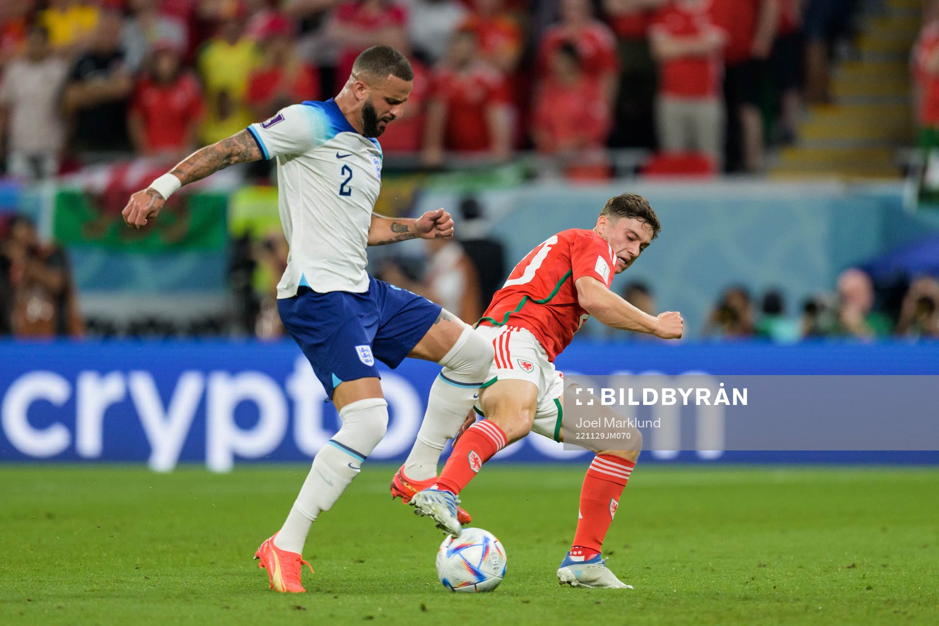 Kyle Walker of England and Daniel James of Wales during the FIFA World Cup 2022 football match between Wales and England on November 29, 2022 in Doha.