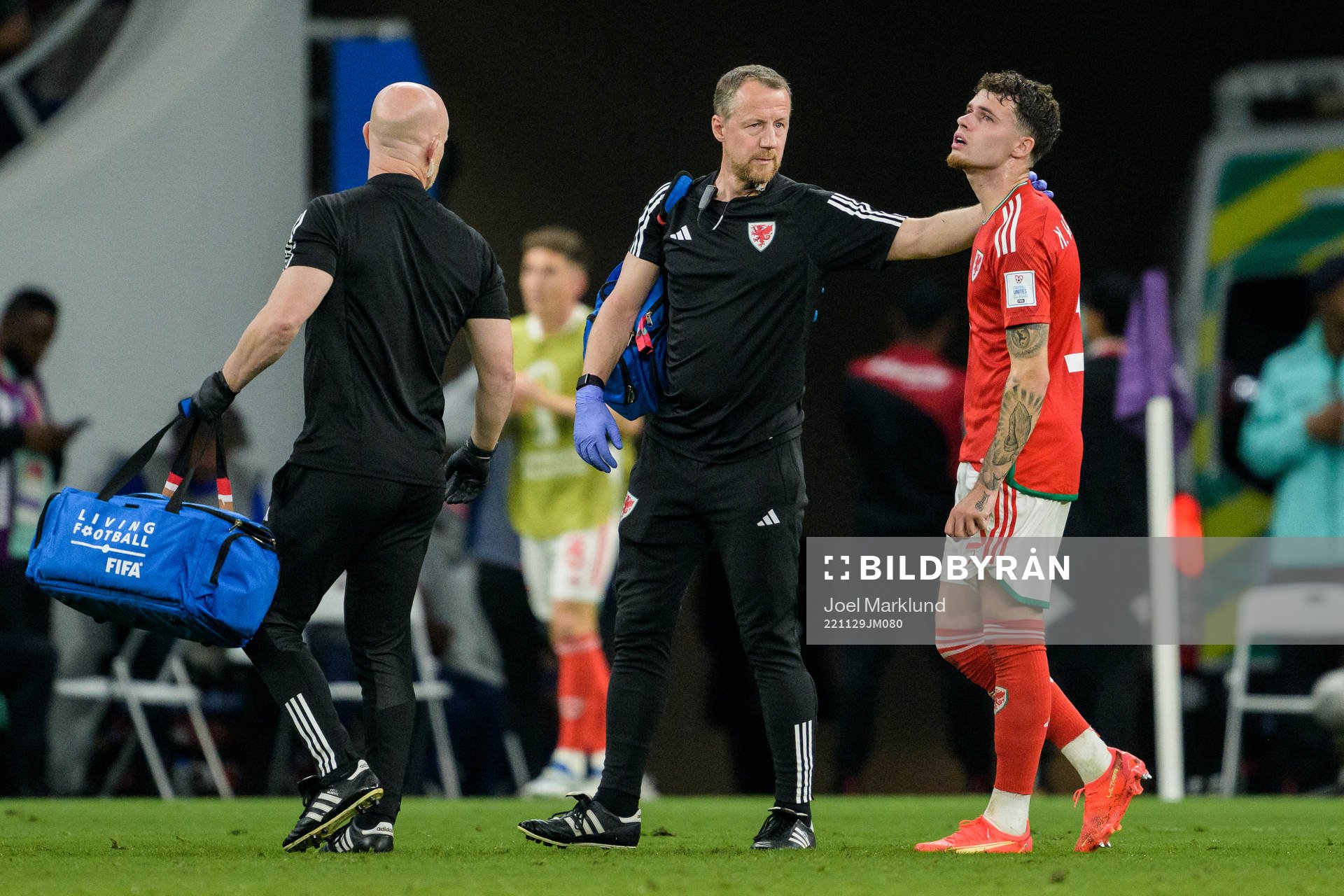 Neco Williams of Wales leaving the pitch injured