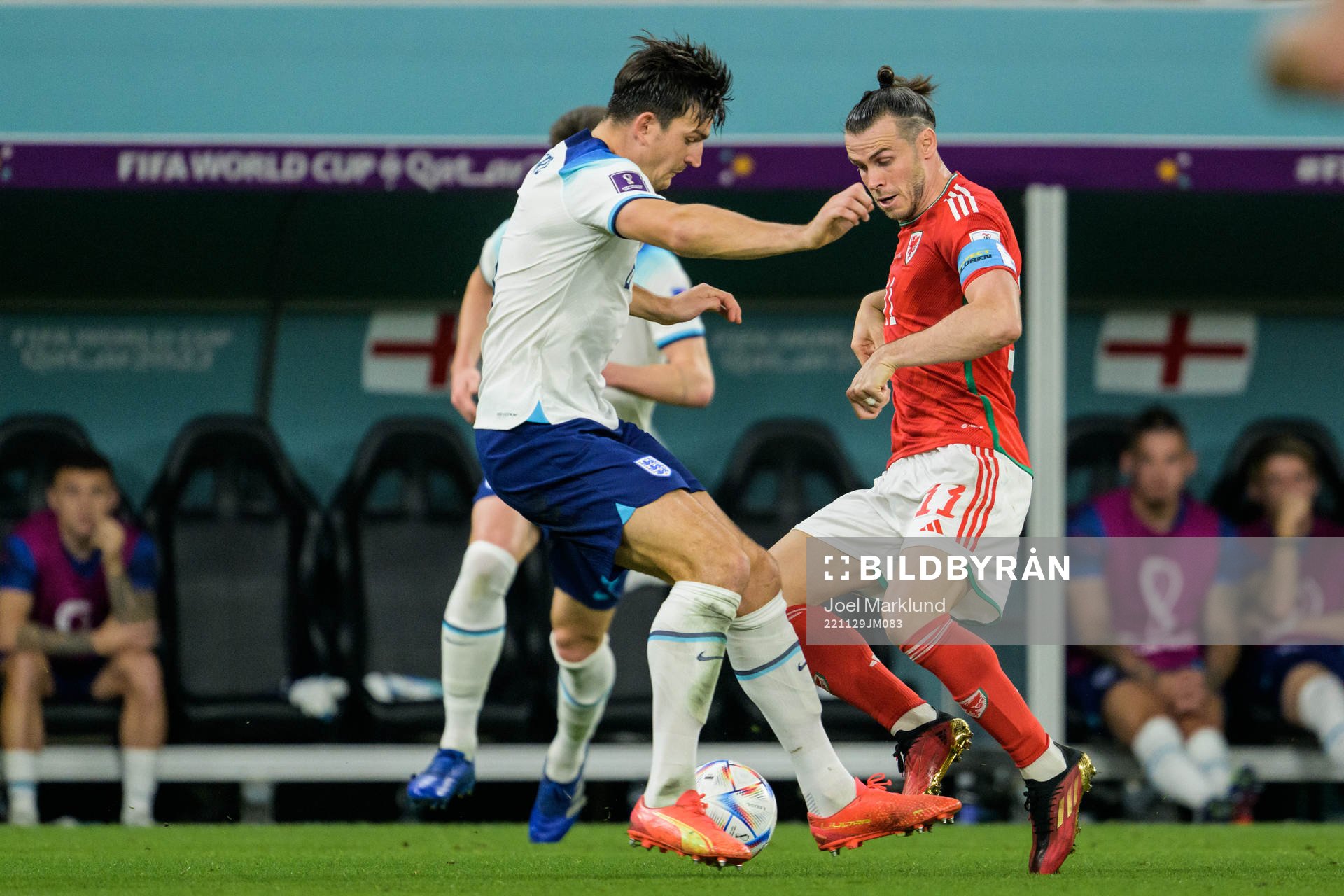 Harry Maguire of England and Gareth Bale of Wales during the FIFA World Cup 2022 football match between Wales and England on November 29, 2022 in Doha.