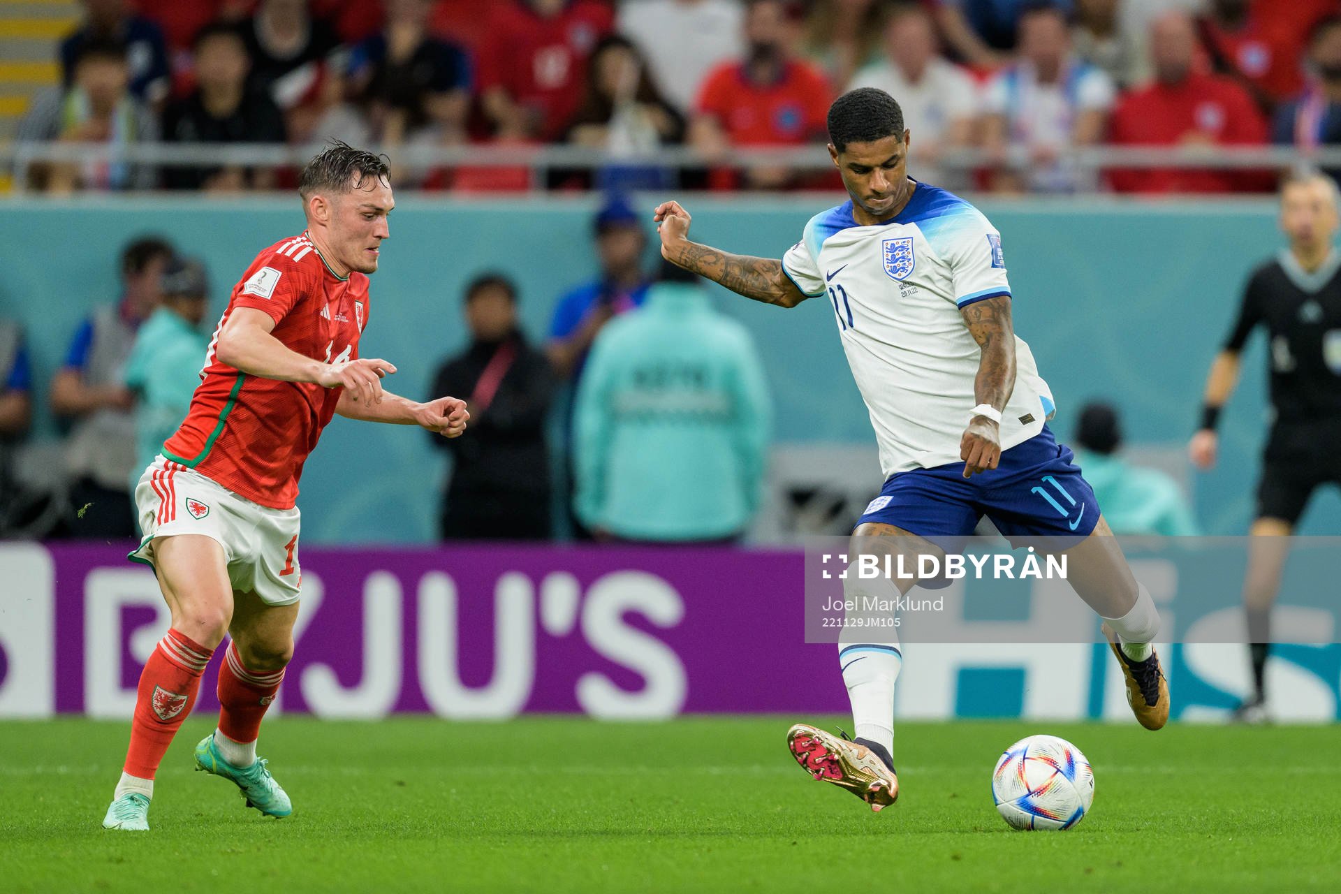 Connor Roberts of Wales and Marcus Rashford of England