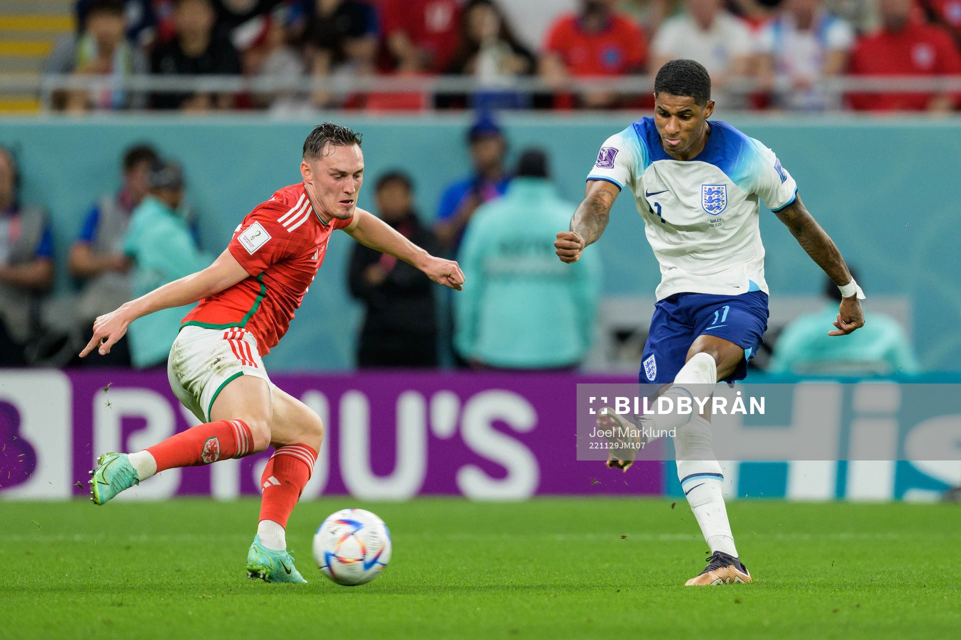 Connor Roberts of Wales and Marcus Rashford of England