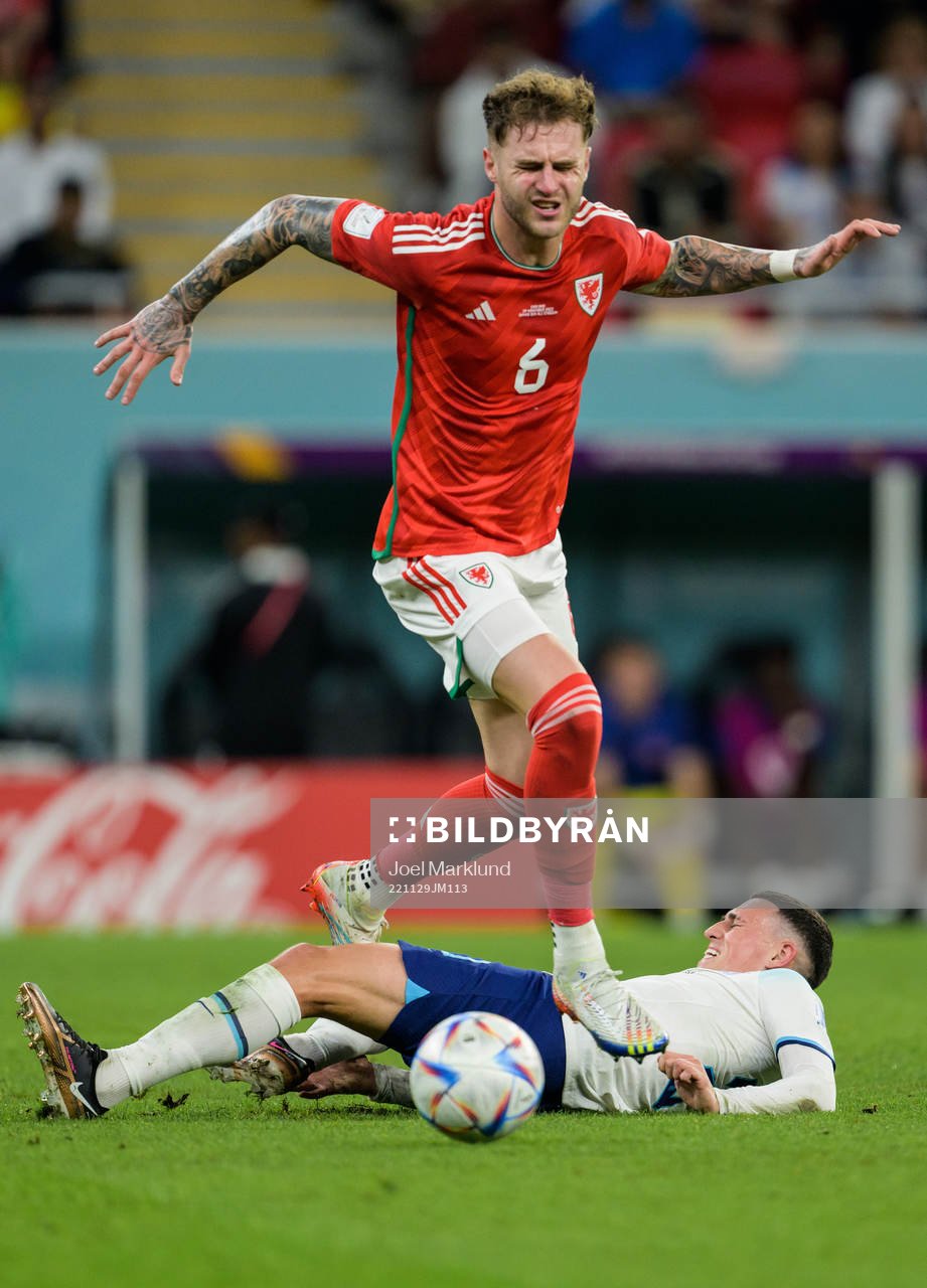 Joe Rodon of Wales and Phil Foden of England