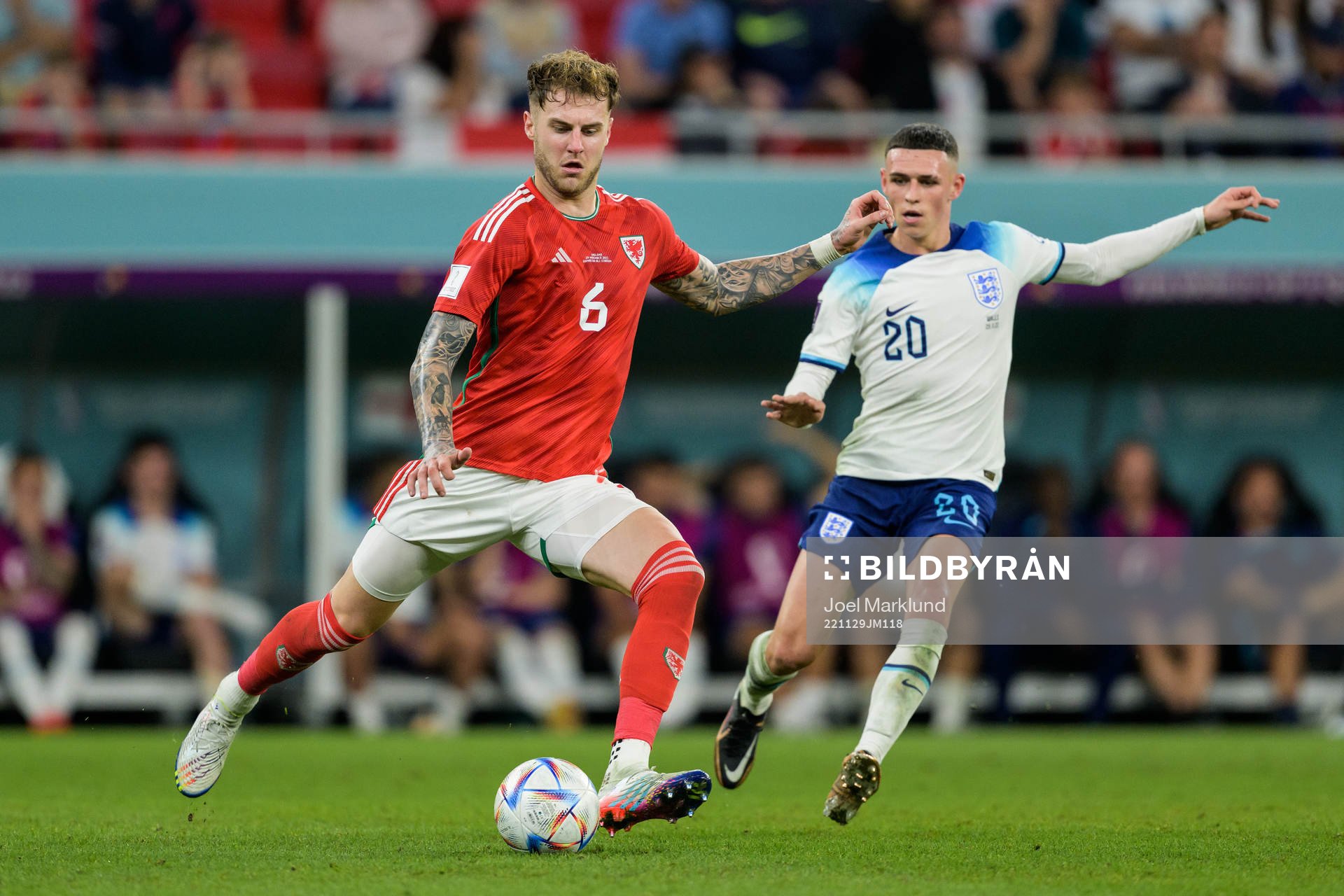 Joe Rodon of Wales and Phil Foden of England