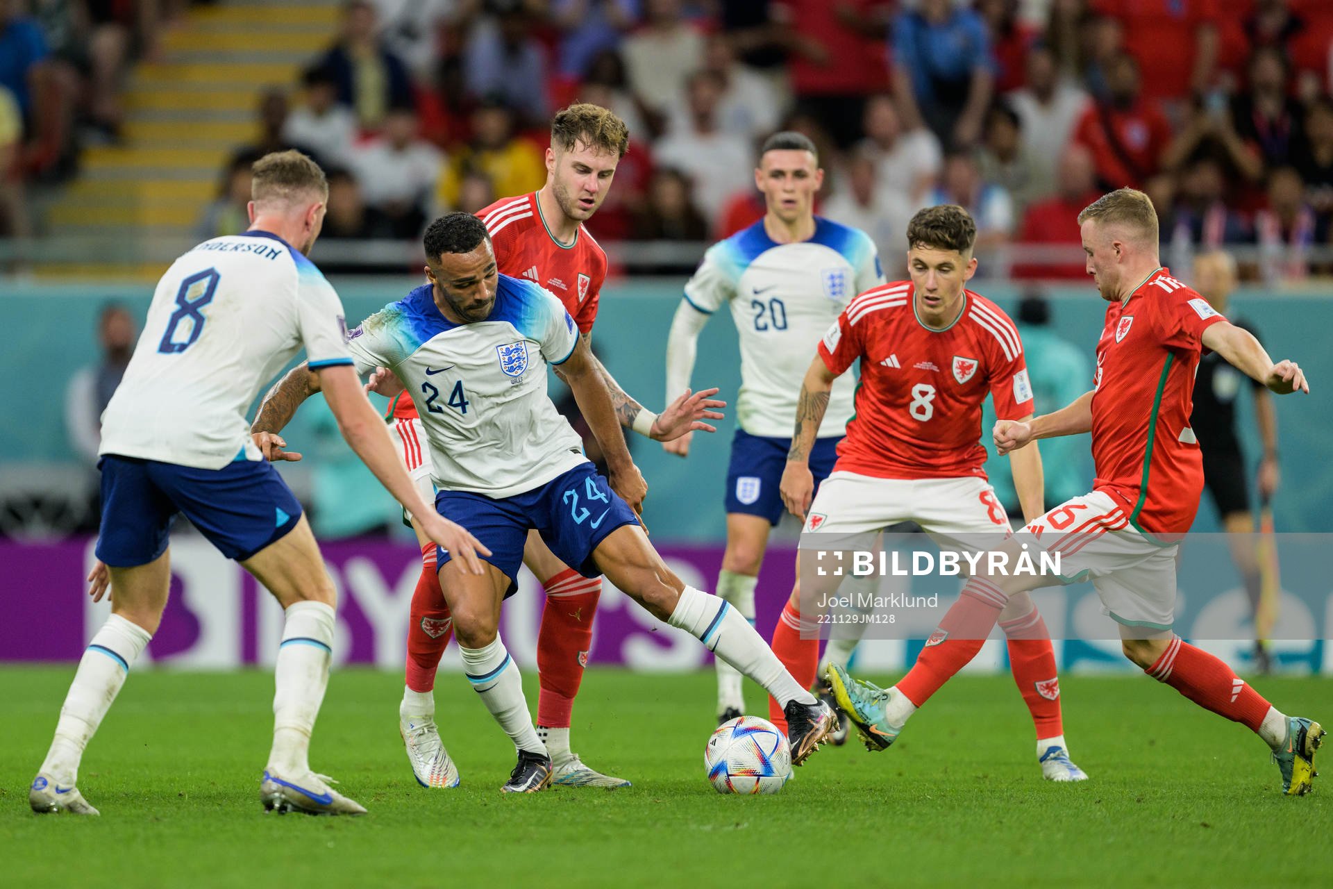 Callum Wilson of England against Joe Rodon, Harry Wilson and Joe Morrell of Wales during the FIFA World Cup 2022 football match between Wales and England on November 29, 2022 in Doha.