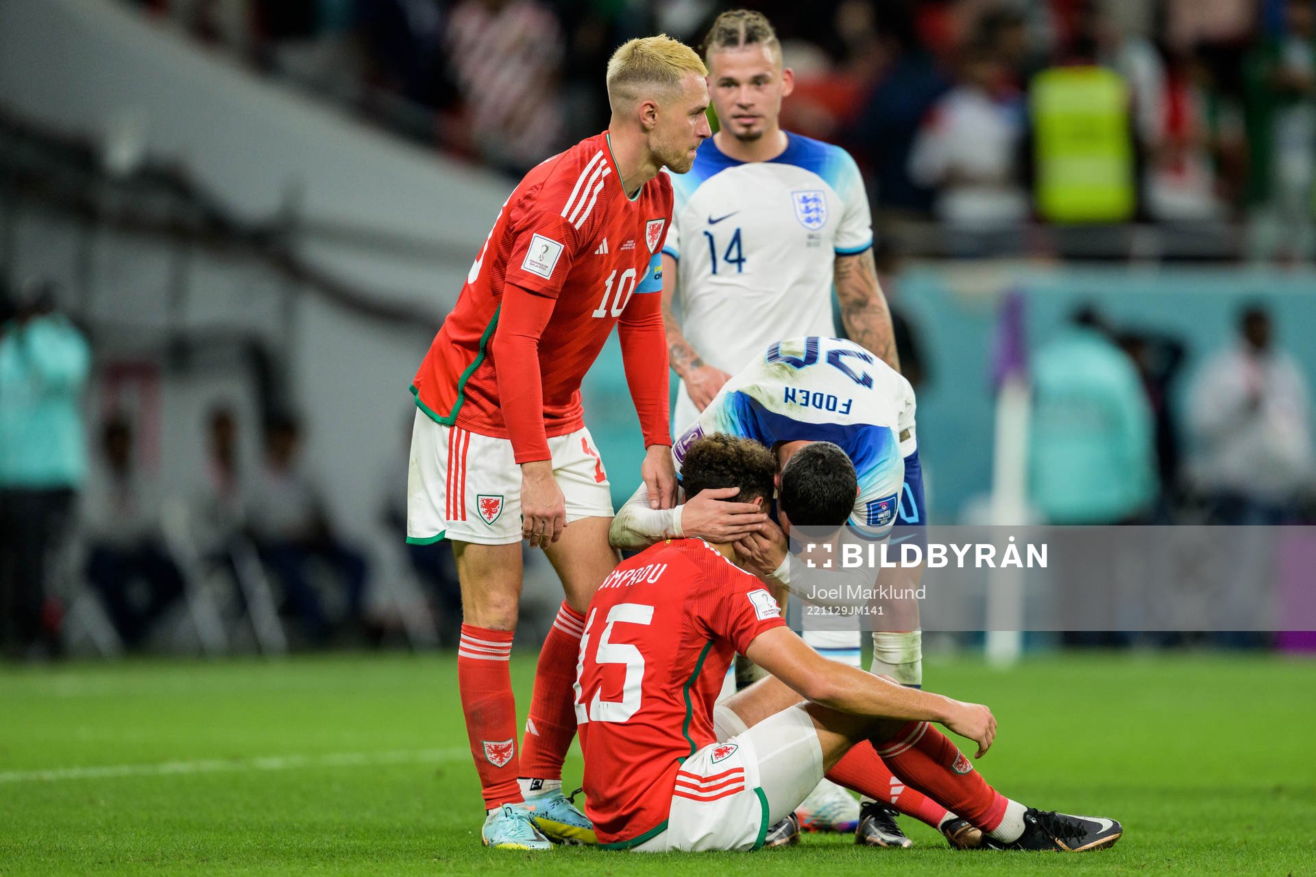 Ethan Ampadu of Wales and Phil Foden of England