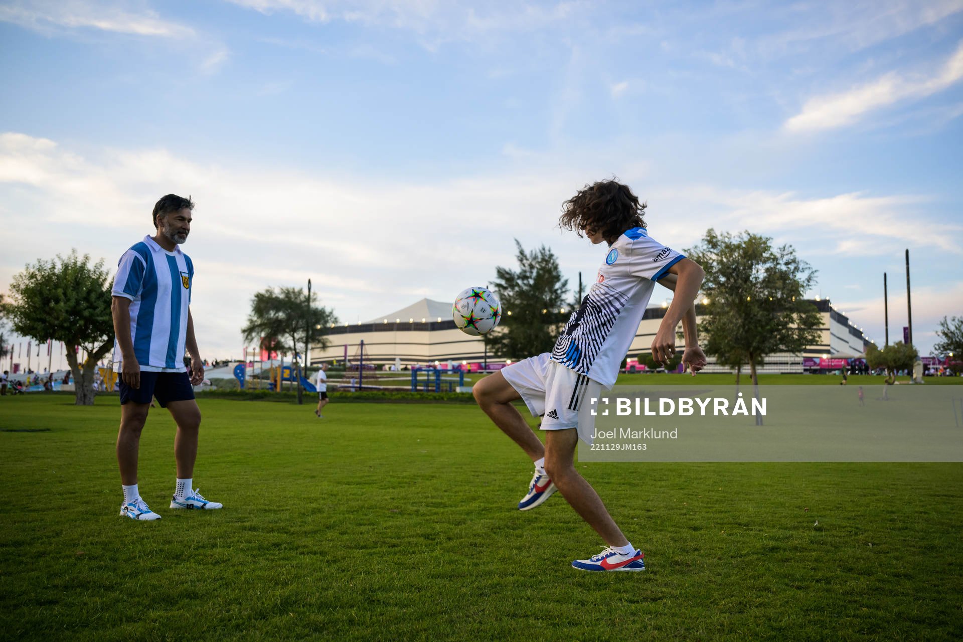 Two people play football
