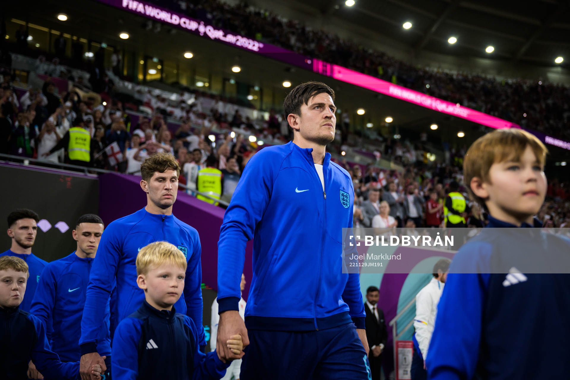 John Stones and Harry Maguire of England enter the pitch