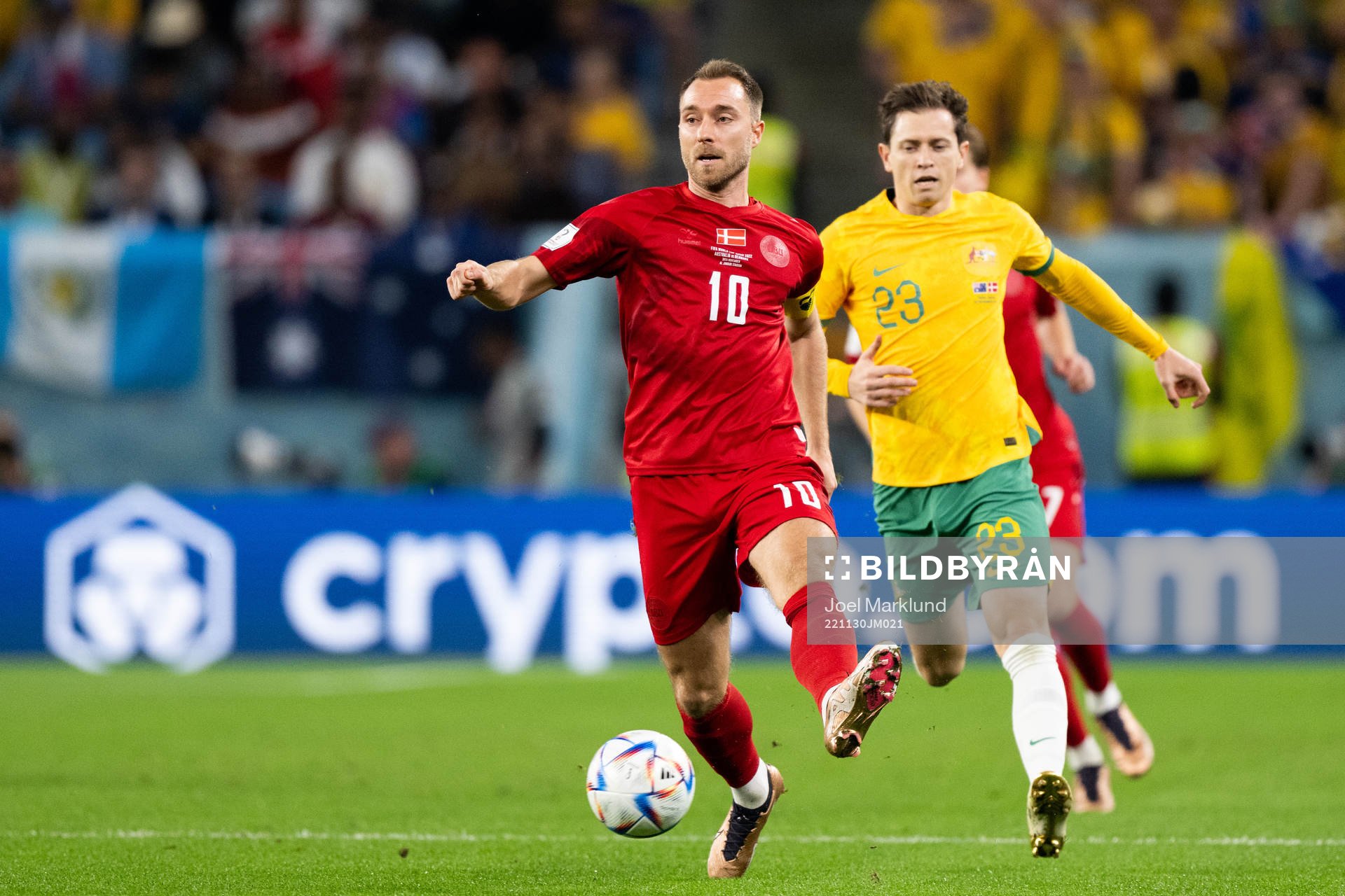 Christian Eriksen of Denmark and Craig Goodwin of Australia