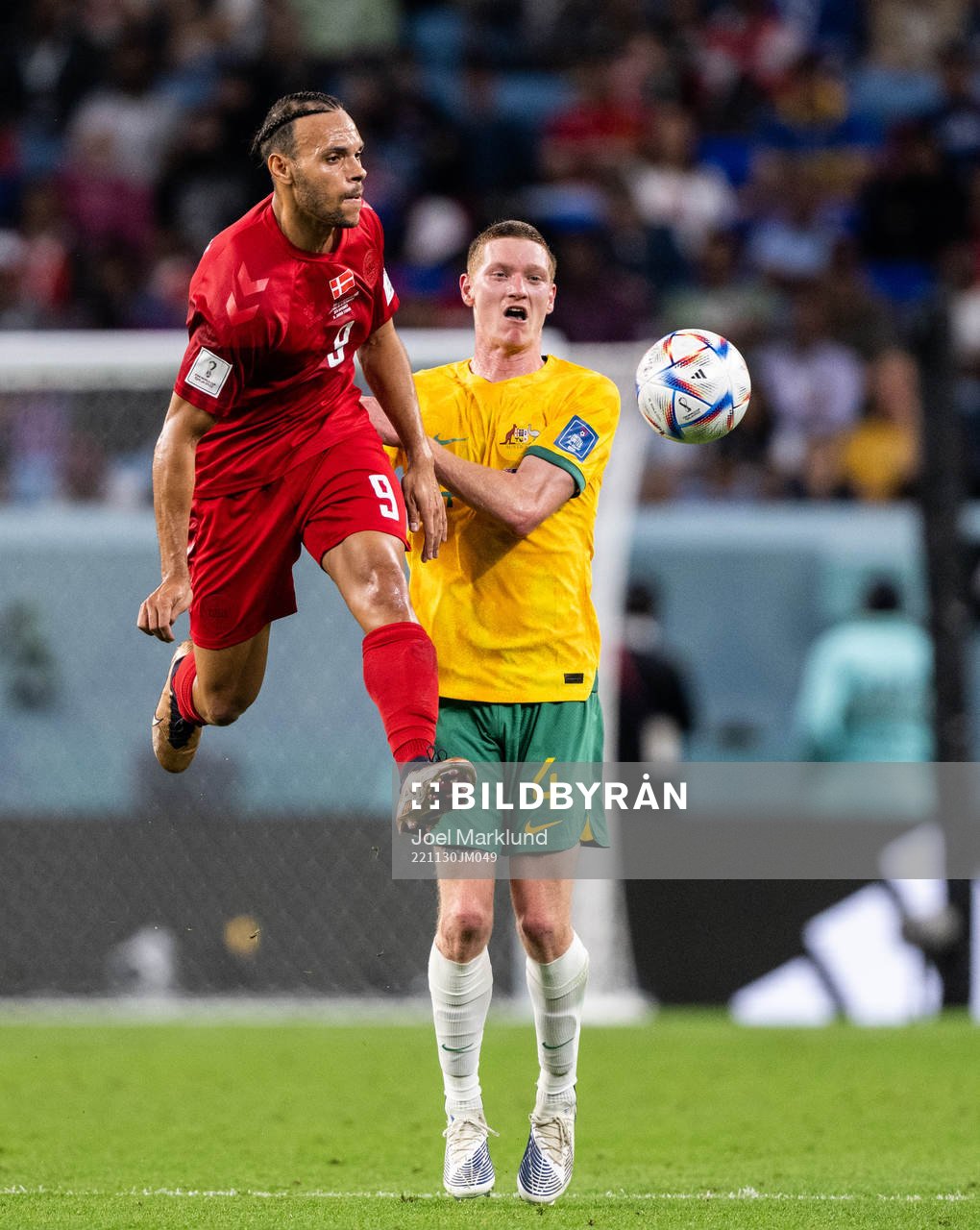 Martin Braithwaite of Denmark and Kye Rowles of Australia