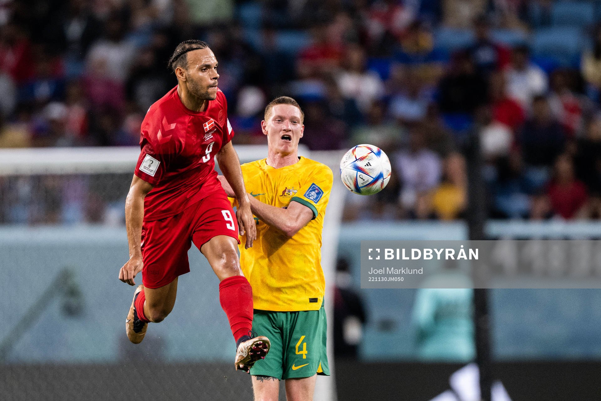 Martin Braithwaite of Denmark and Kye Rowles of Australia