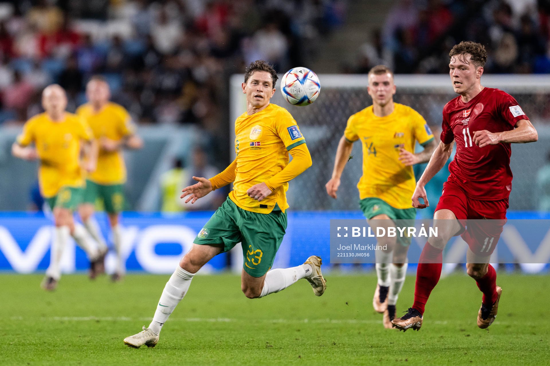 Craig Goodwin of Australia and Andreas Skov Olsen of Denmark