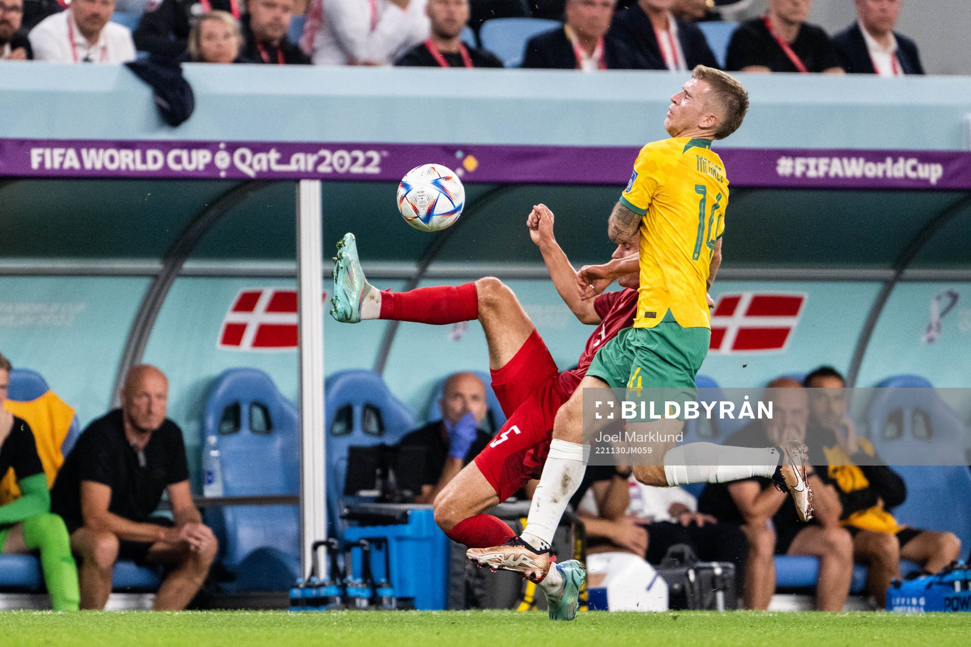 Joakim Mæhle of Denmark and Riley McGree of Australia during the FIFA World Cup 2022 football match between Australia and Denmark on November 30, 2022 in Doha.