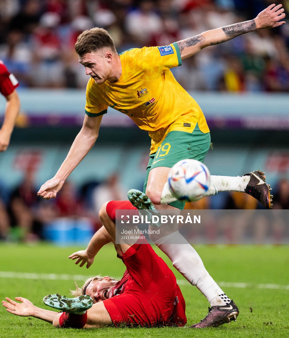 Kasper Dolberg of Denmark and Harry Souttar of Australia in