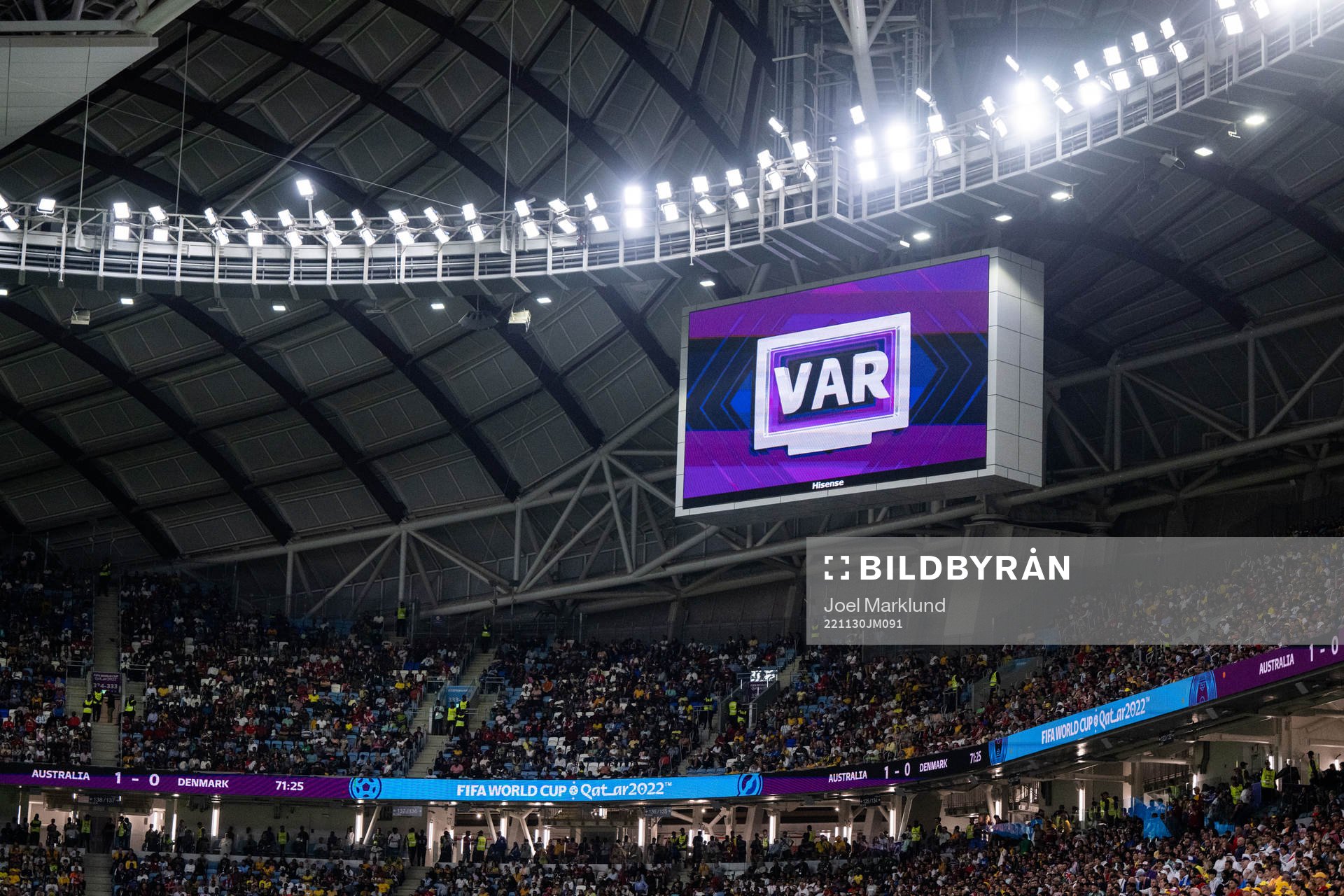 A big screen displays a VAR review message during the FIFA World Cup 2022 football match between Australia and Denmark on November 30, 2022 in Doha.