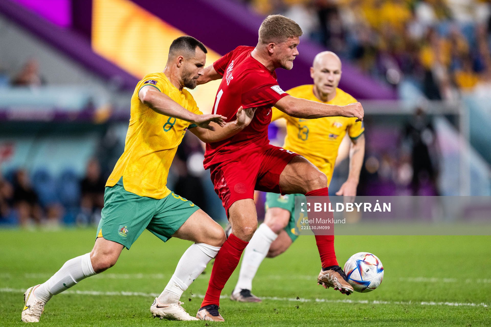 Bailey Wright of Australia and Andreas Cornelius of Denmark