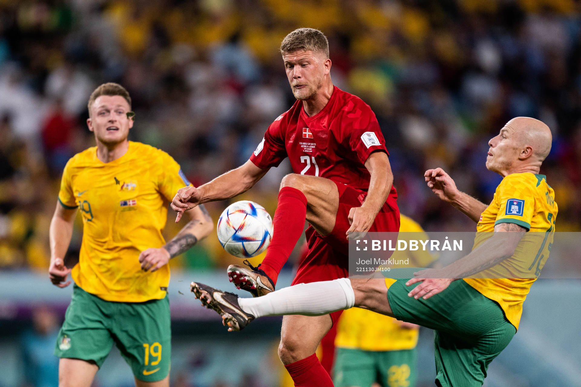 Andreas Cornelius of Denmark against Harry Souttar and Rasmus Kristensen of Australia during the FIFA World Cup 2022 football match between Australia and Denmark on November 30, 2022 in Doha.