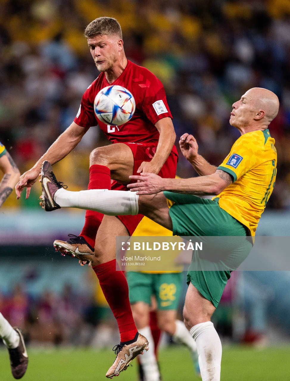 Andreas Cornelius of Denmark against Harry Souttar and Rasmus Kristensen of Australia during the FIFA World Cup 2022 football match between Australia and Denmark on November 30, 2022 in Doha.