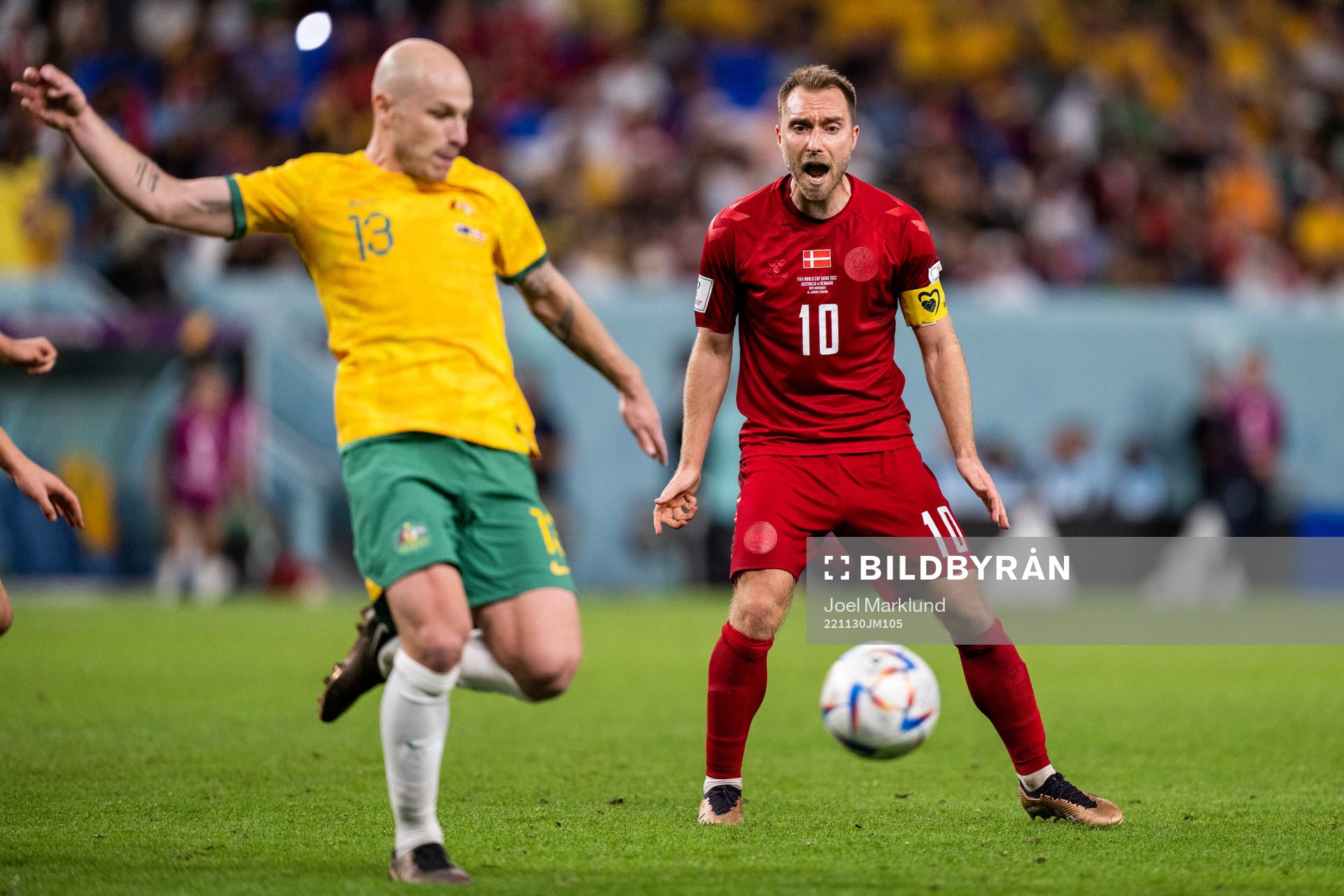 Aaron Mooy of Australia and Christian Eriksen of Denmark