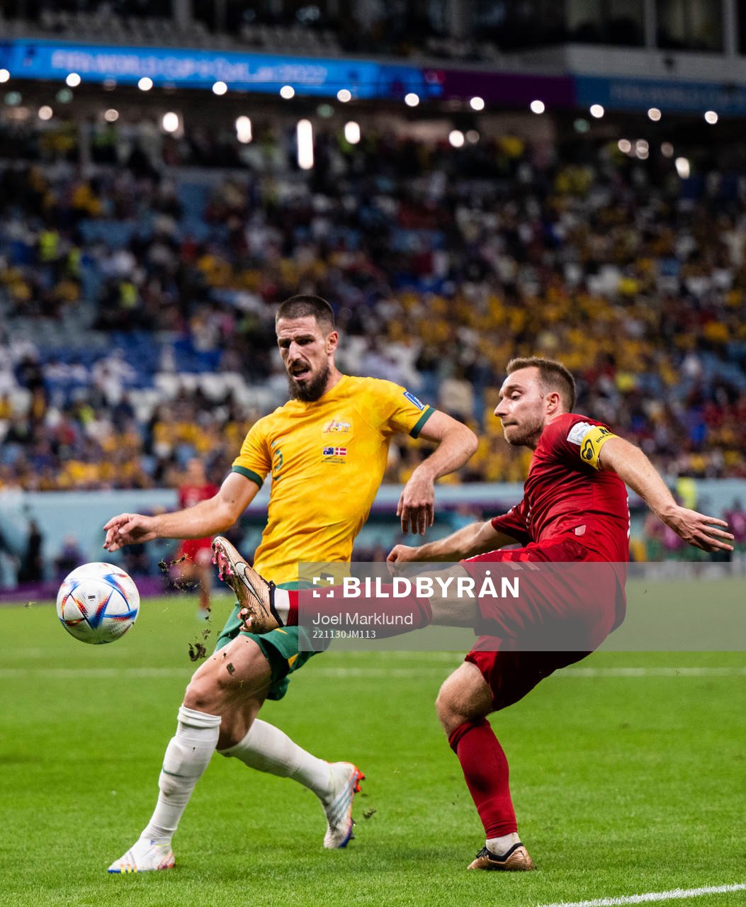 Milos Degenek of Australia and Christian Eriksen of Denmark