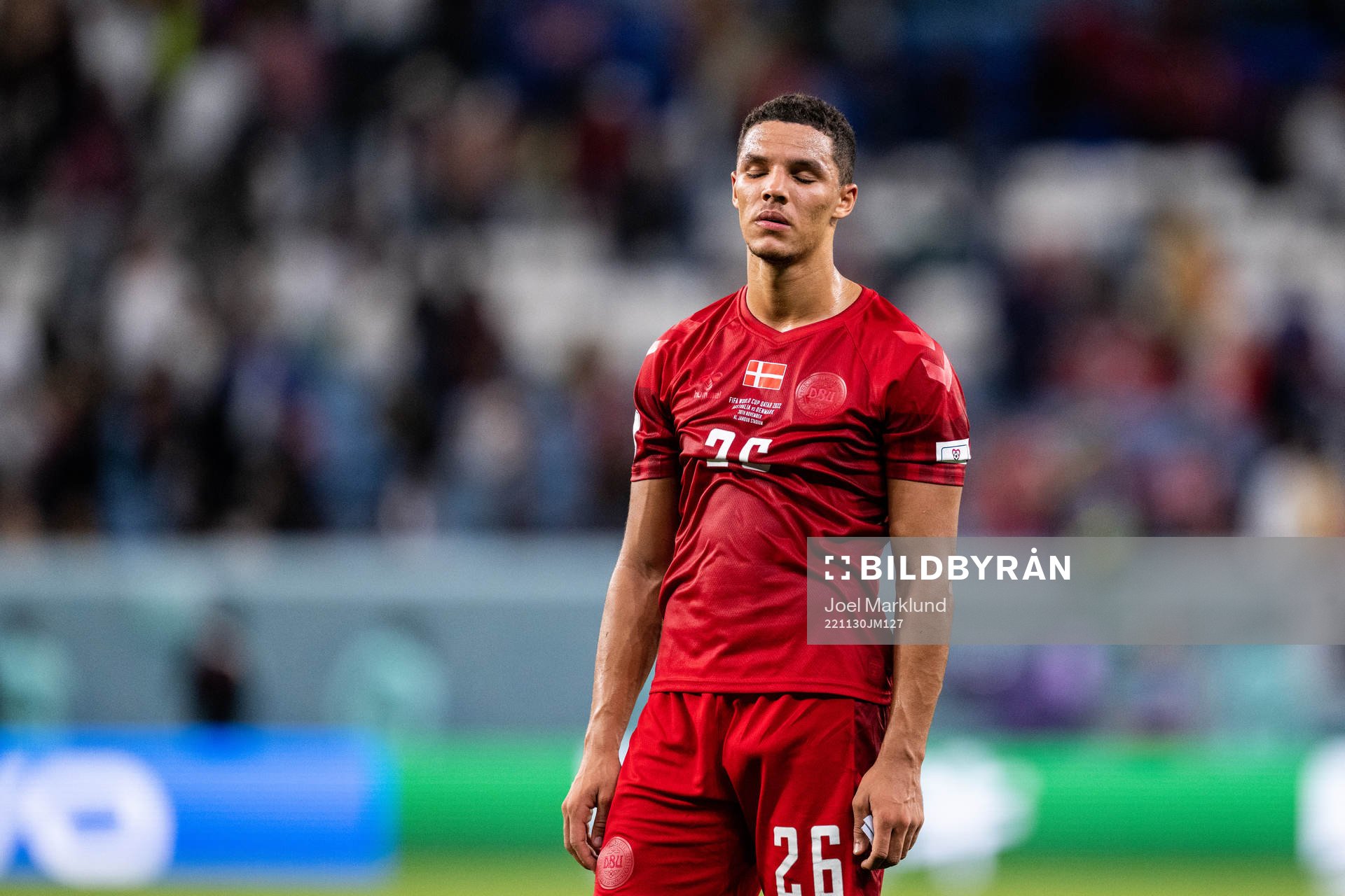 Alexander Bah of Denmark looks dejected