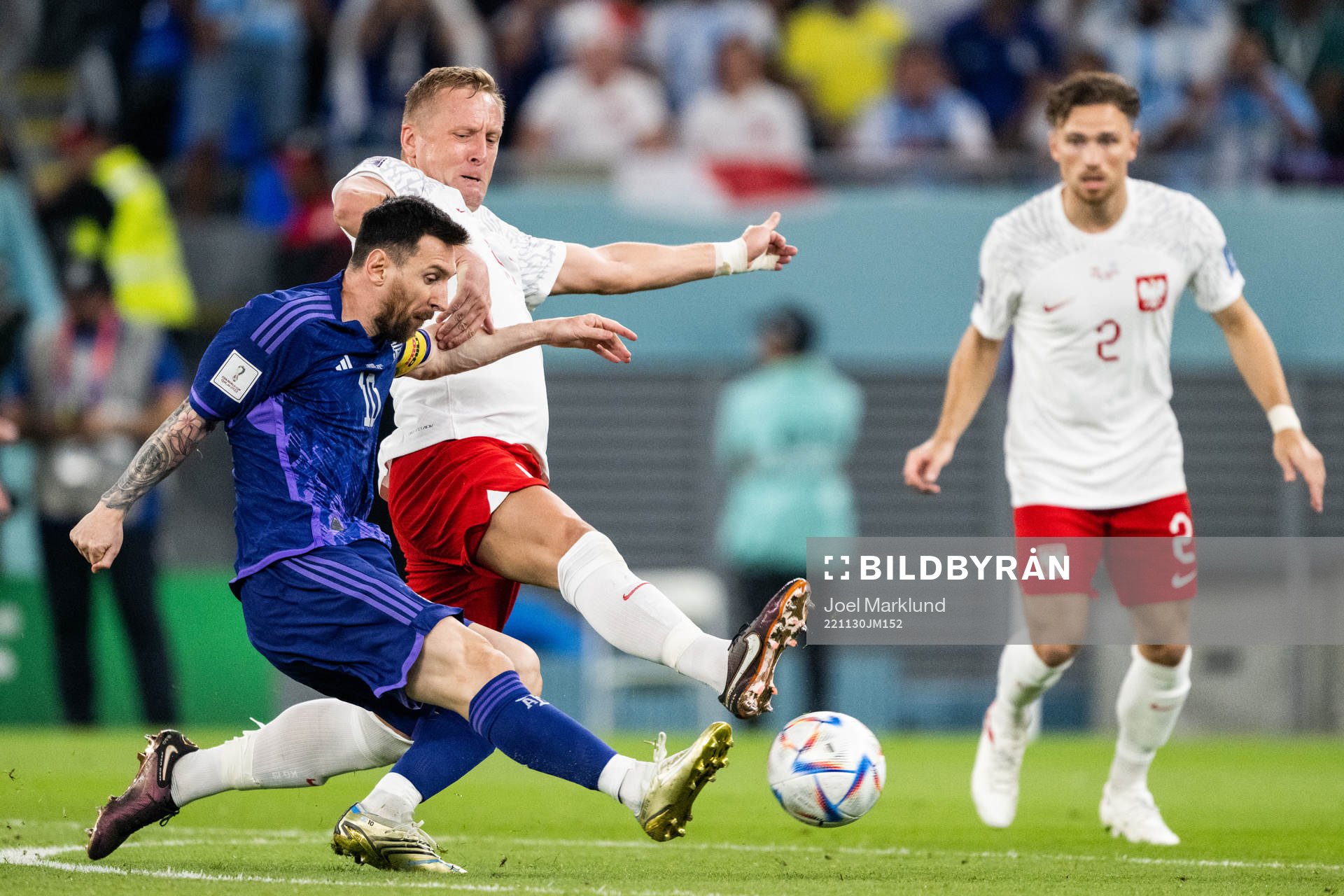 Lionel Messi of Argentina and Kamil Glik of Poland