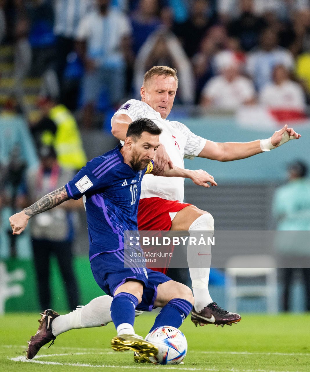 Lionel Messi of Argentina and Kamil Glik of Poland