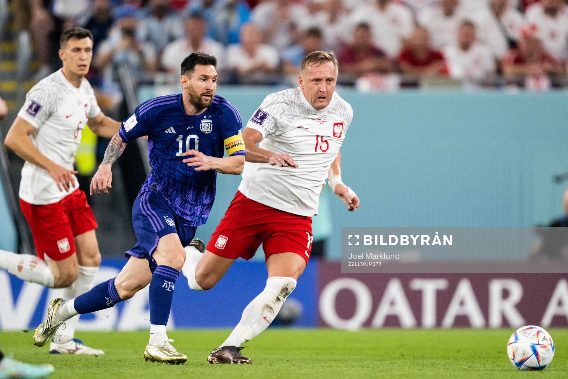 Lionel Messi of Argentina and Kamil Glik of Poland