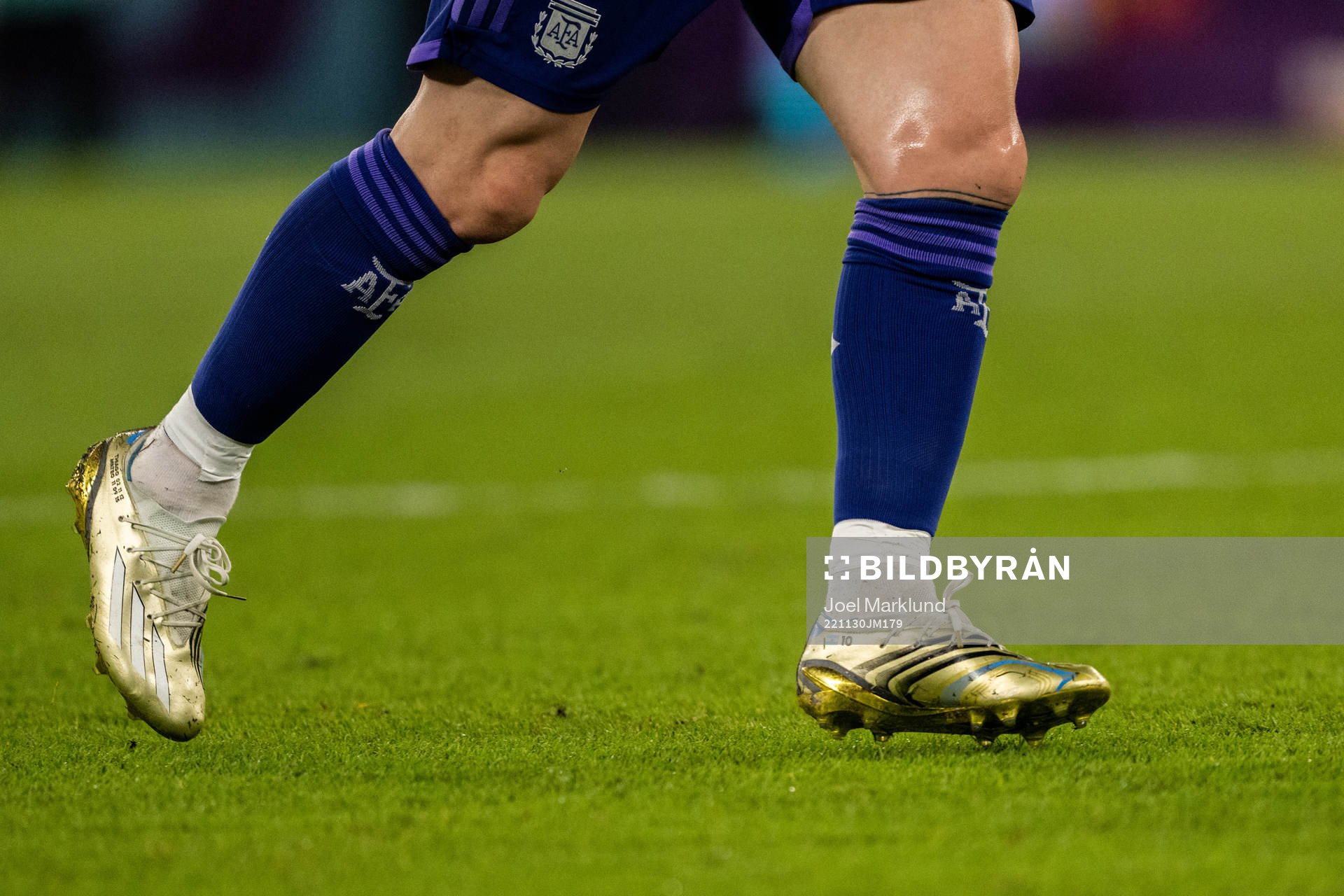 Detailed view of the golden boots of Lionel Messi of