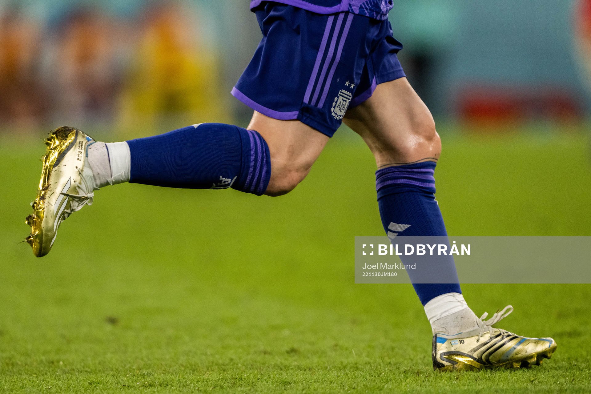 Detailed view of the golden boots of Lionel Messi of