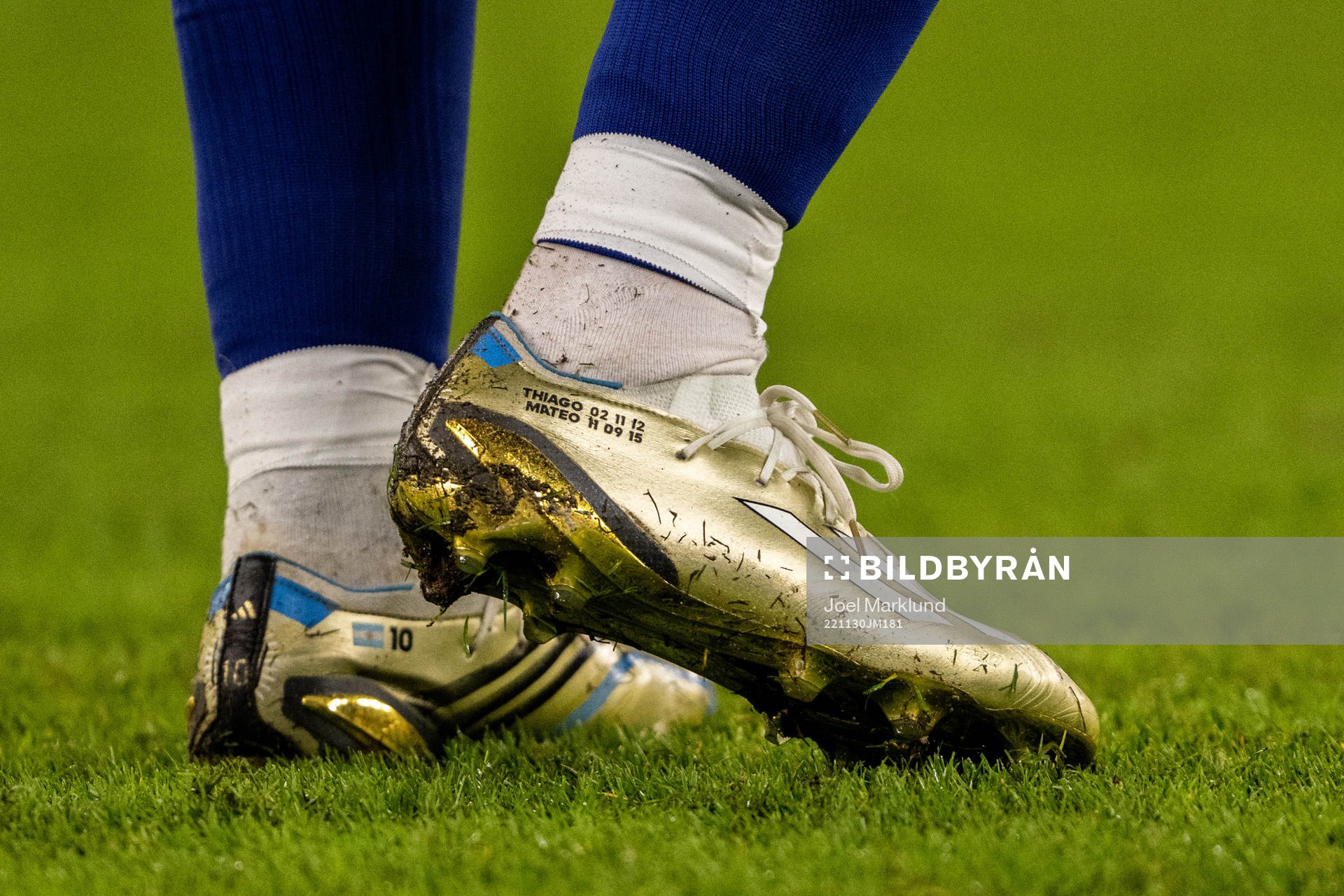 Detailed view of the golden boots of Lionel Messi of