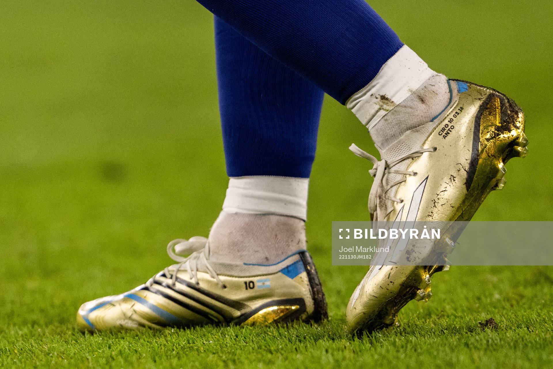 Detailed view of the golden boots of Lionel Messi of