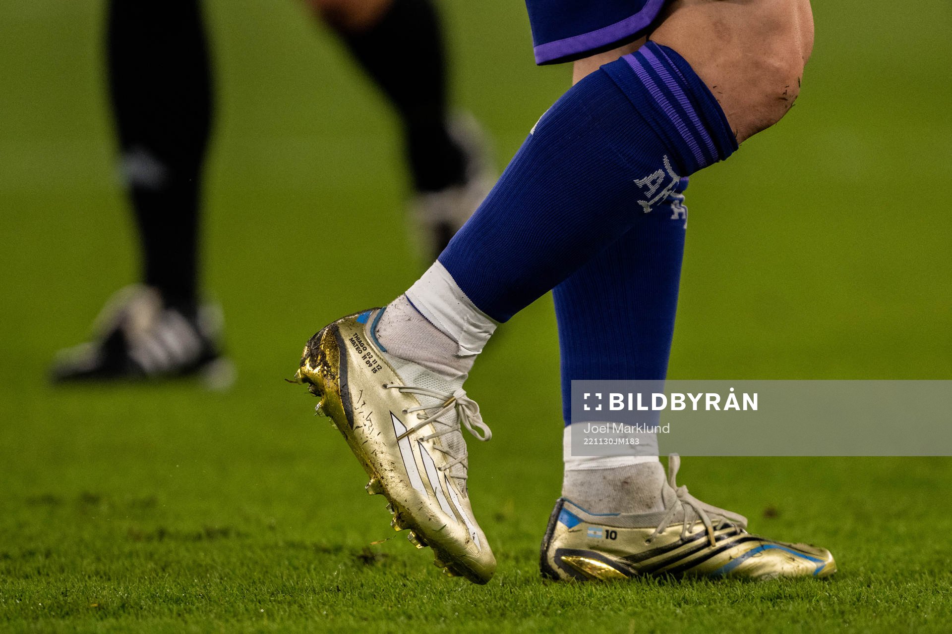 Detailed view of the golden boots of Lionel Messi of