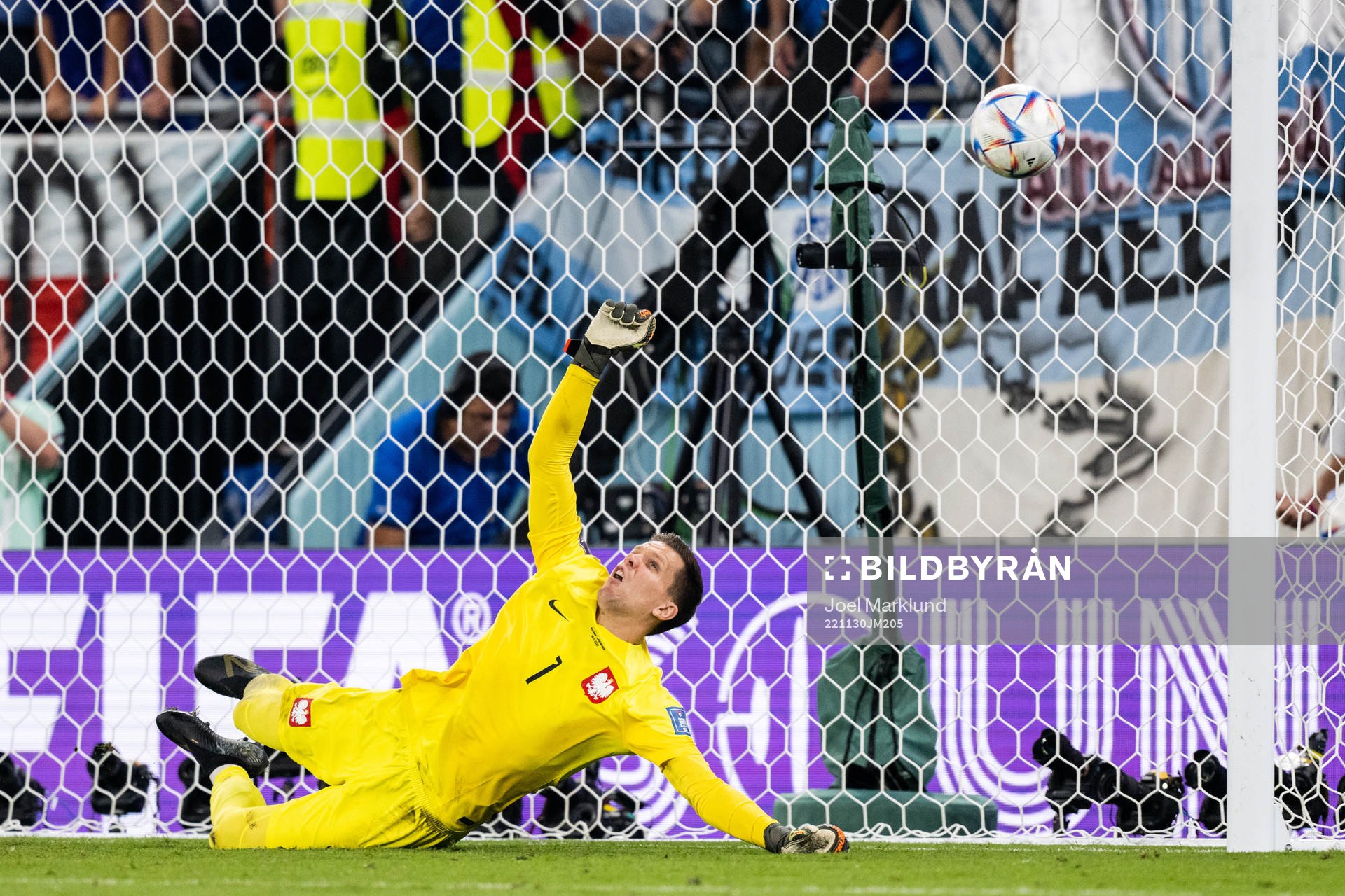 Goalkeeper Wojciech Szczesny of Poland saves a penalty