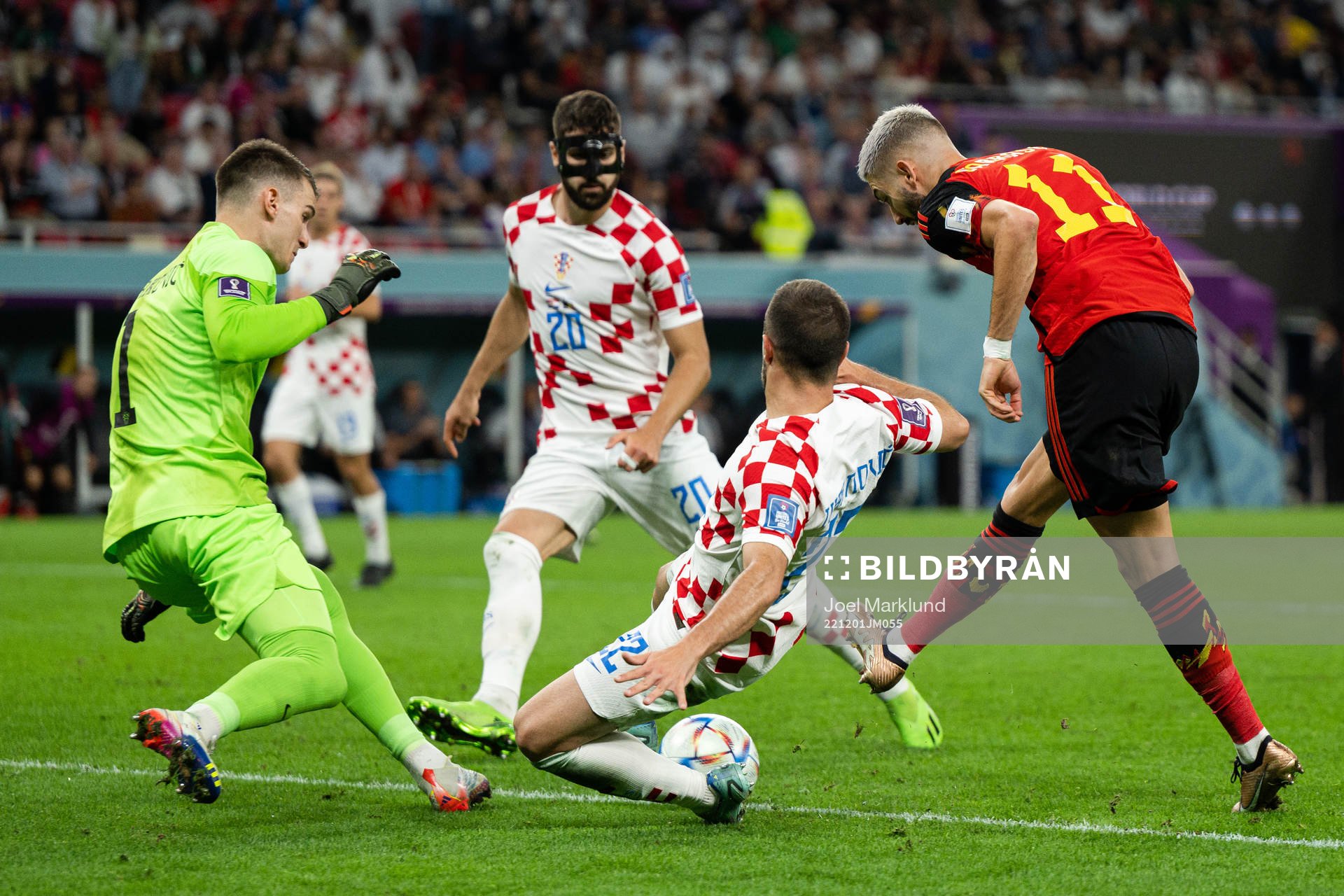 Yannick Carrasco of Belgium against goalkeeper Dominik Livakovic , Josko Gvardiol and Josip Juranovic of Croatia during the FIFA World Cup 2022 football match between Croatia and Belgium on December 1, 2022 in Doha.
